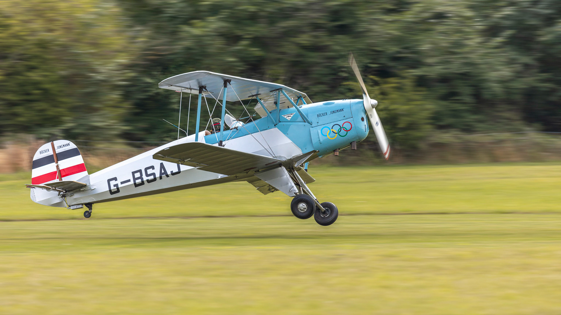 Old Warden, UK - 4th August 2019: A vintage Bucker Jungmann aircraft landing on a grass airfield