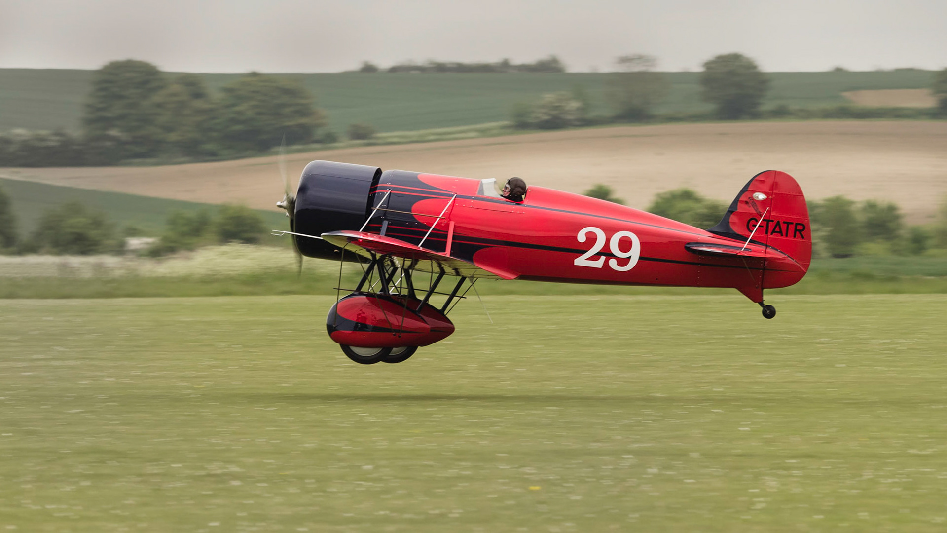 Duxford, UK - May 23rd 2015: A vintage US Travel Air Type R Mystery Ship aircraft, flying at Duxford VE Day Airshow