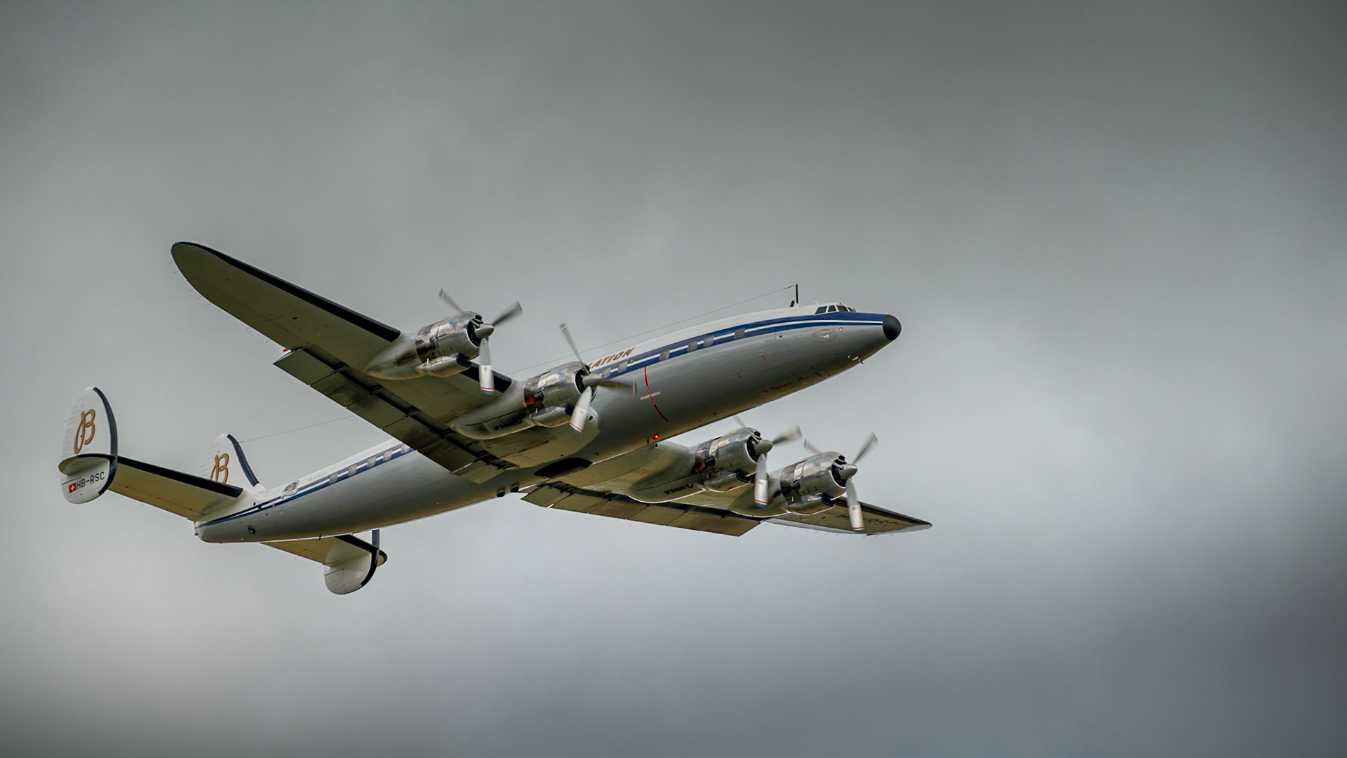 Duxford,UK - 13 July 2014: Lockheed C-121C Super Constellation owned by Breitling, in flight  at Duxford Flying Legends Airshow