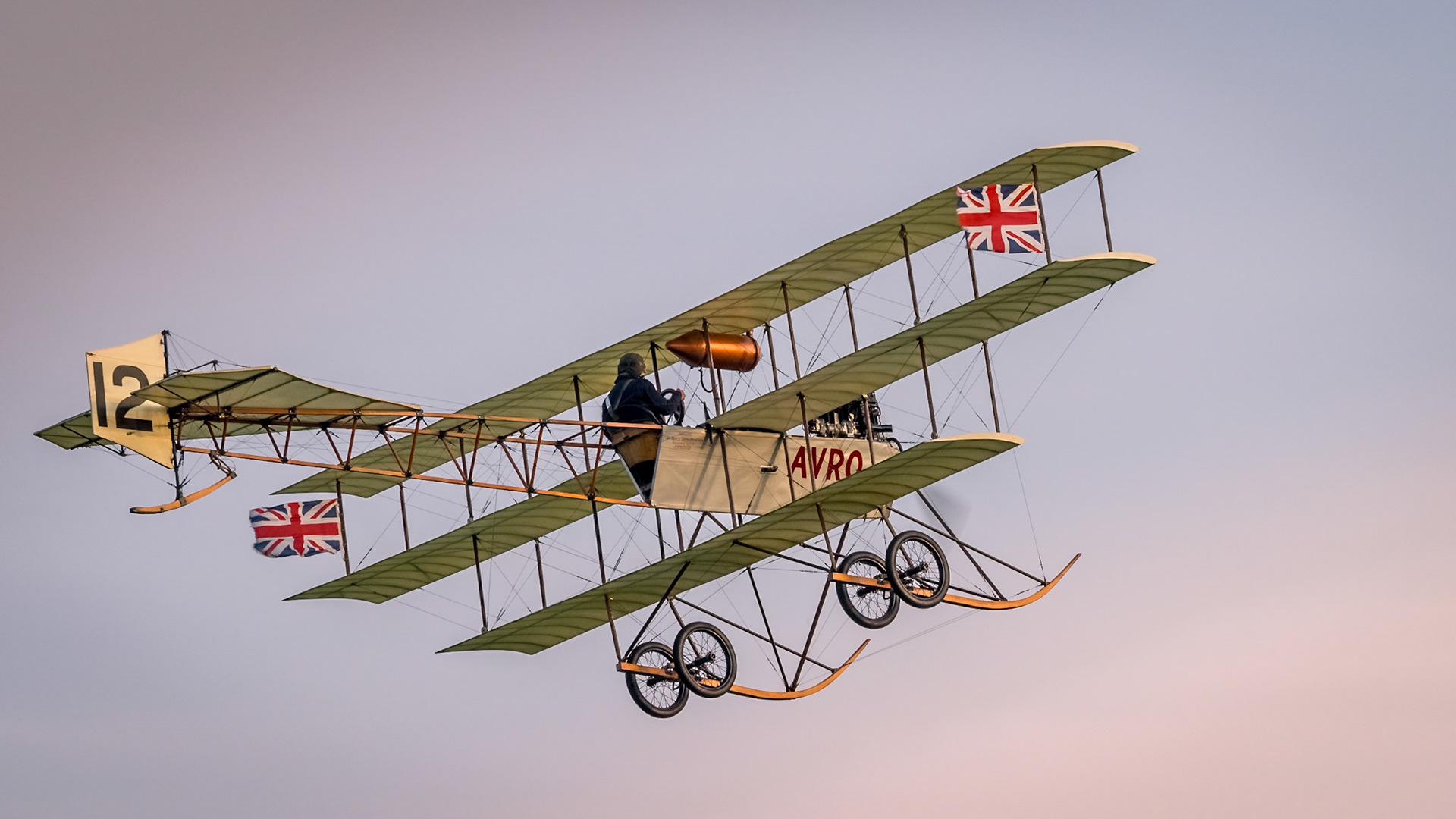 Biggleswade, UK 04/10/2015: A vintage Avro Triplane flies over Shuttleworth airfield in the late evening
