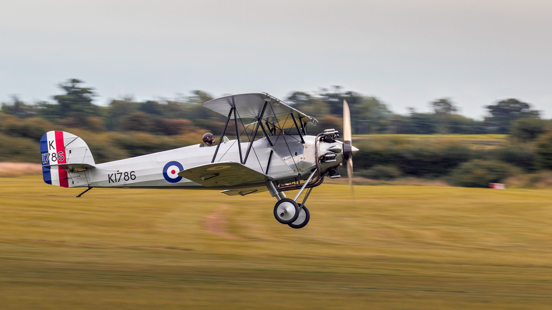 Biggleswade, UK - 7th May 2017: Vintage 1928 Hawker Tomtit biplane in flight