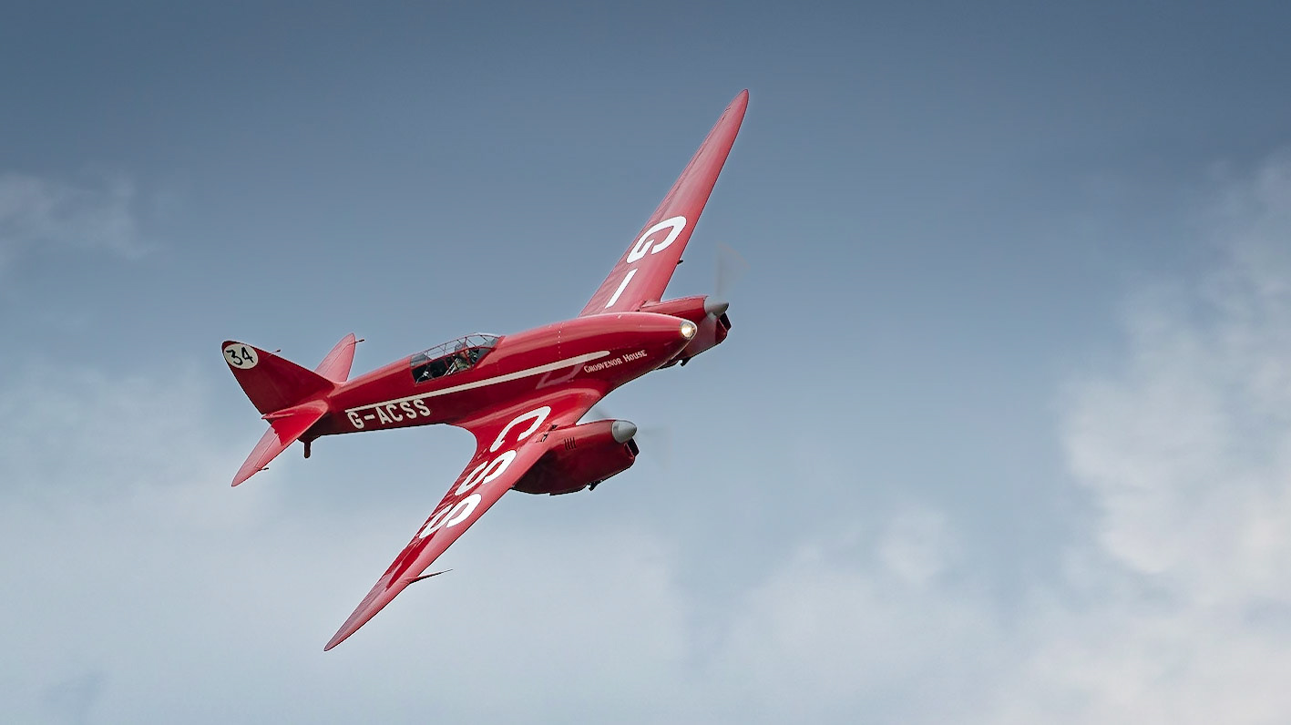 Old Warden, UK - 4th August 2019: A vintage racing de Havilland DH.88 Comet l in flight