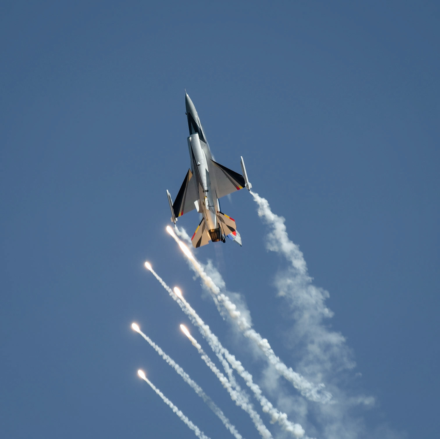 F16 fighter releasing flares