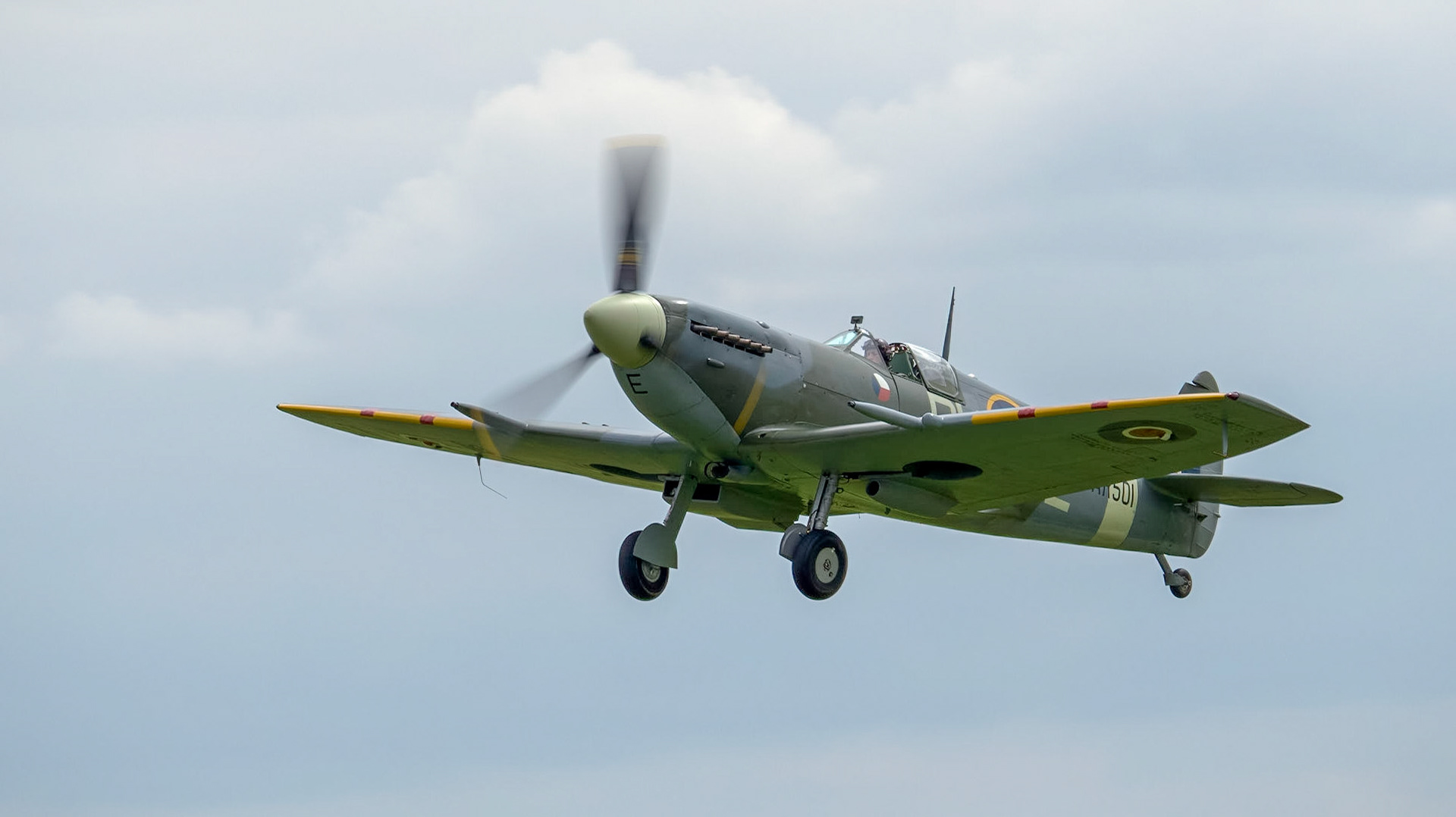 A  vintage RAF Spitfire aircraft in flight