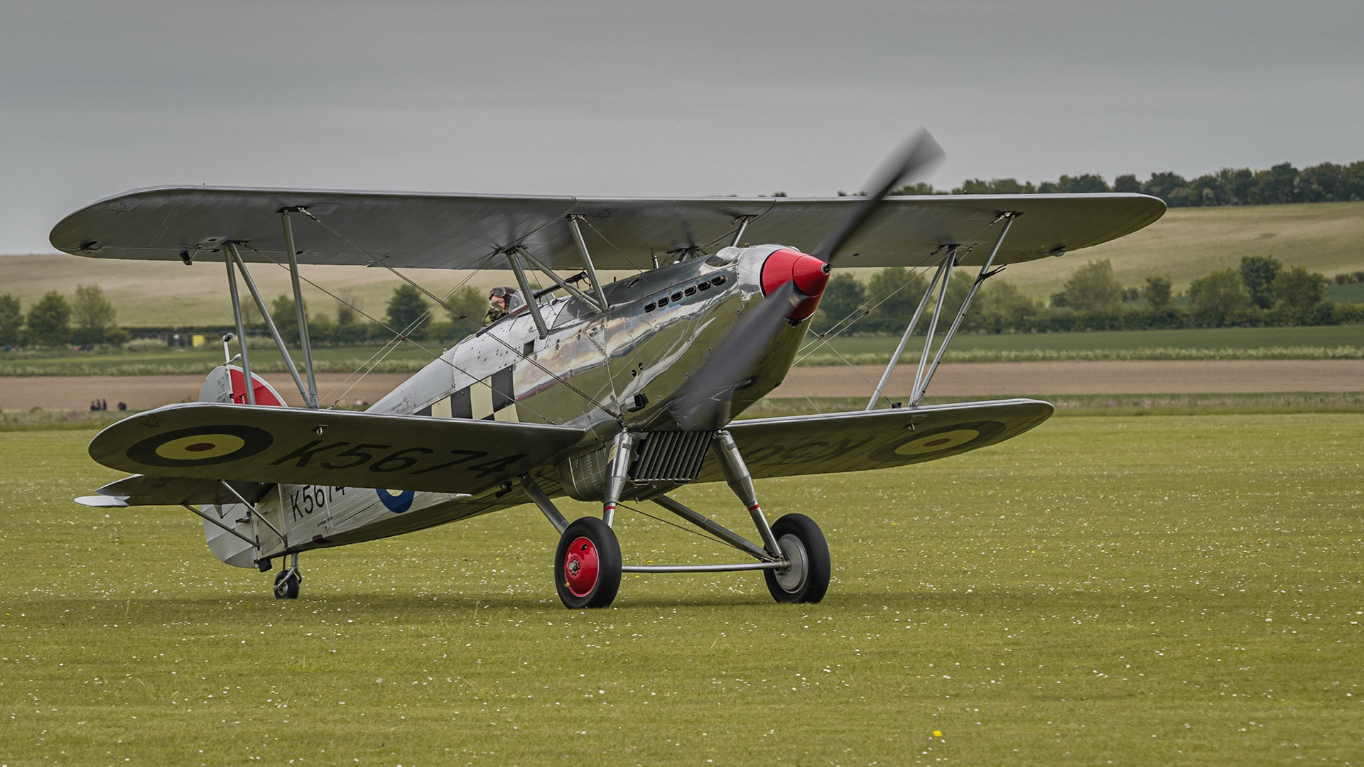 Duxford, UK - May 23rd 2015: Vintage British Hawker Fury Biplane, displaying at Duxford VE Day Airshow