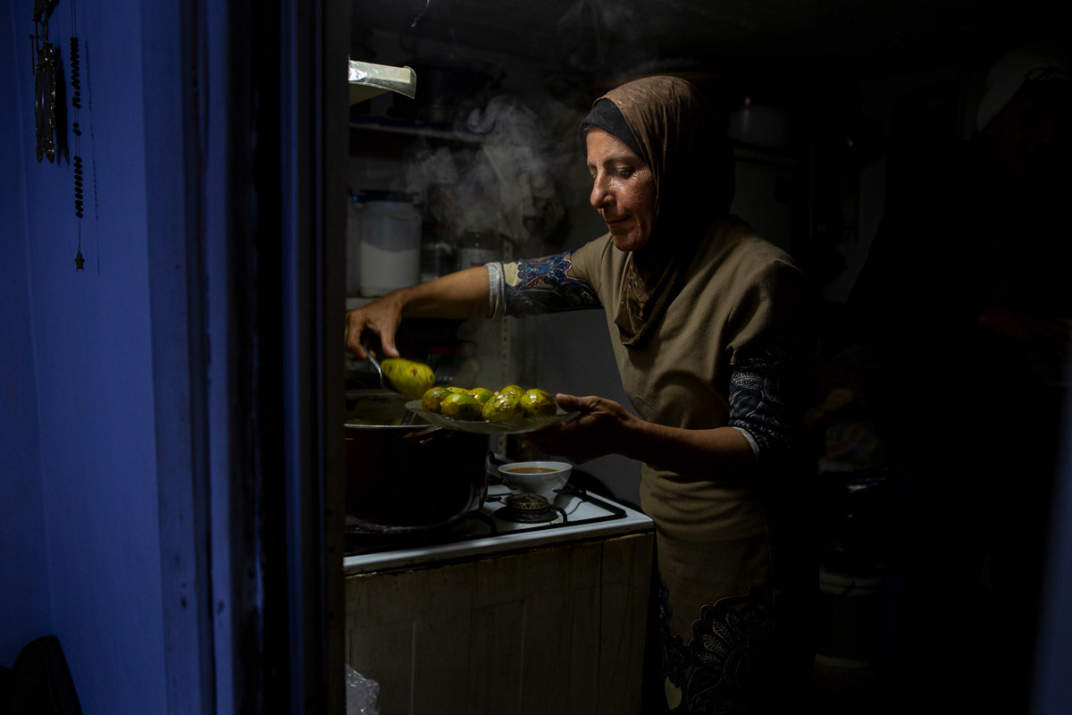 Ward cooks for her sisters and their kids with some left over zuchinnis from their previous planting season. Ward cooks everyday for her family and they usually rely on their own produce for daily meals. (12/15/2024)