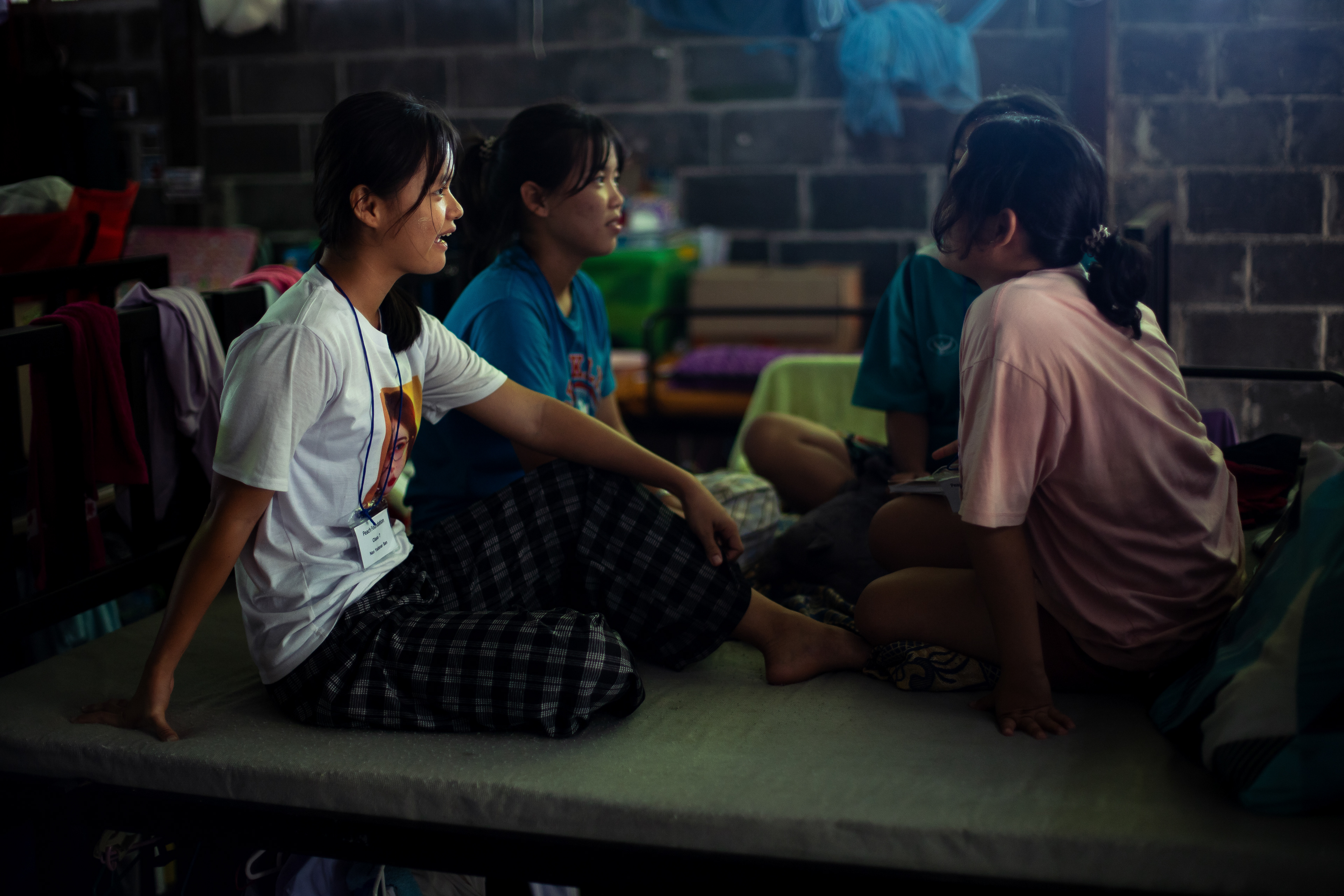 Nan Yadanar San sits with friends in the girls’ dormitory at KKB School in Mae Sot, Thailand. She fled to Thailand after her village was attacked by the Burmese army and now lives at the school during the academic term. For Nan Yadanar San, her classmates and teachers have become a surrogate family while she is away from home.