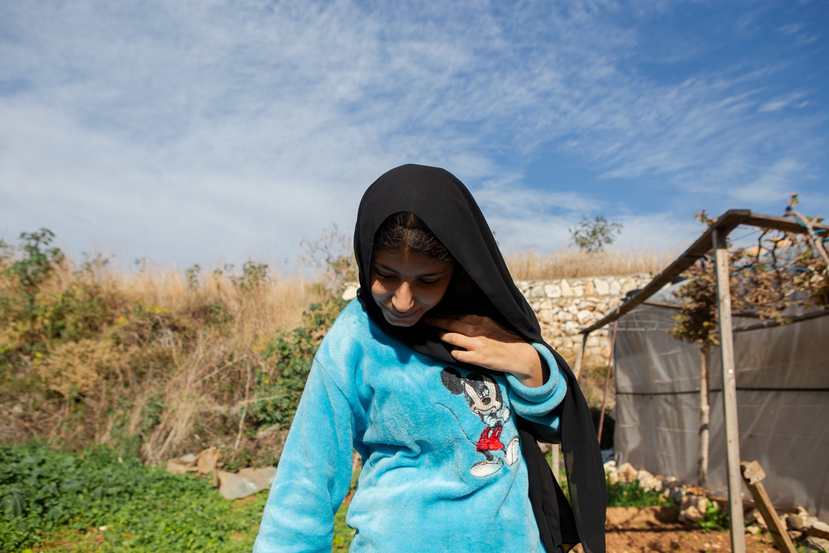 Ghazieye's daughter pours coffee for her mother's guests who visit often and at short notice. She doesn't go to school and remains at home doing household chores. (12/16/2024)
