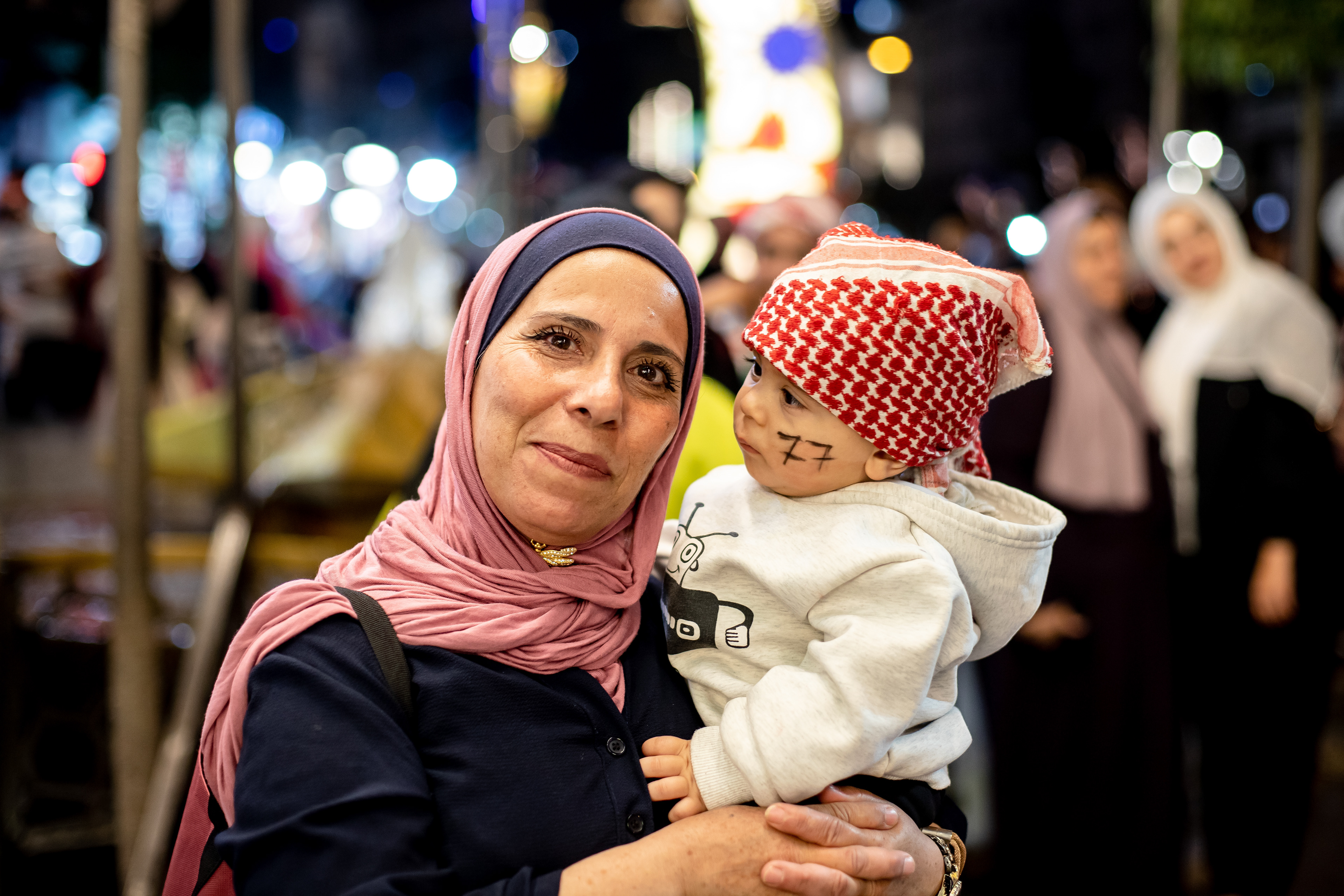 Portrait of a woman holding her son on Independance day in the Balad. Jordan was celebrating 77 years of independance.