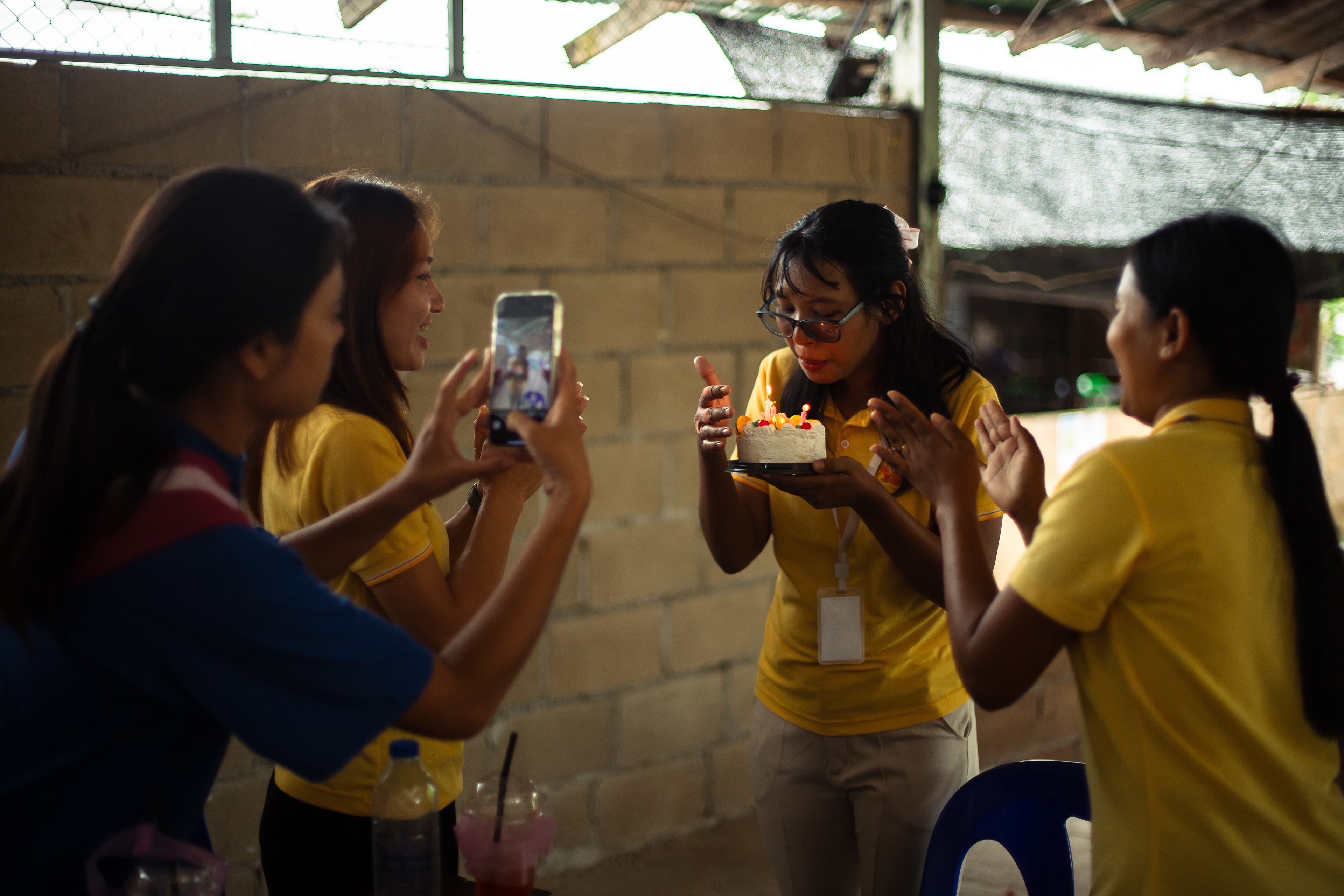 Naw Hser Tha Mote's colleague celebrates her birthday during the school's lunch break. July 2024