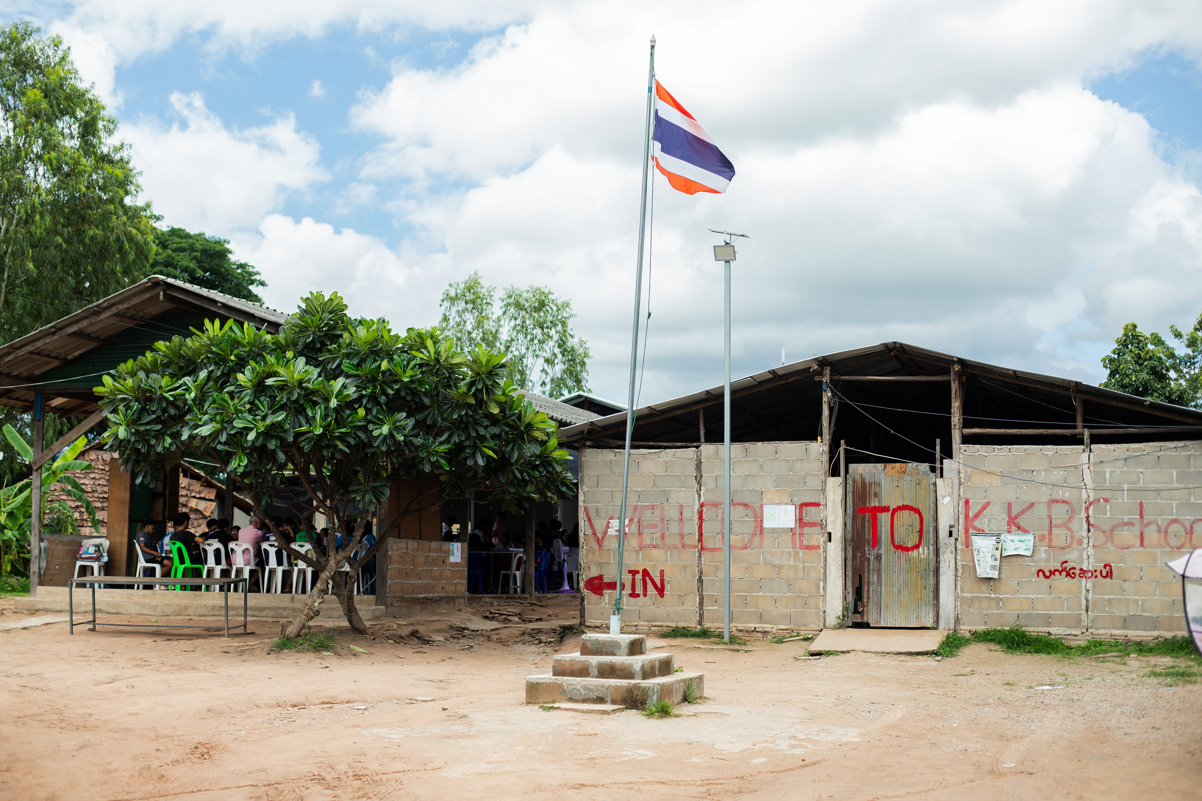 KKB School grounds during class time. Located in Mae Sot, KKB is one of many migrant schools serving children who have fled conflict in Myanmar. The Thai flag flies on the school grounds as a gesture of respect to their host country, and students begin each day by singing the Thai national anthem. These schools are not officially recognised by the Thai government and at the end of last year, Thai officials shut down many migrant schools. The Peach foundation and Givology support over 12 schools in the Mae Sot region. July 2024