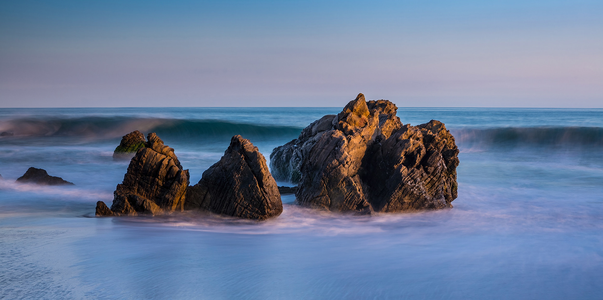 Waves upon the rocky shoreline of  Leo Carrillo Beach, Malibu, CA {062416_LeoCarillo_015} 