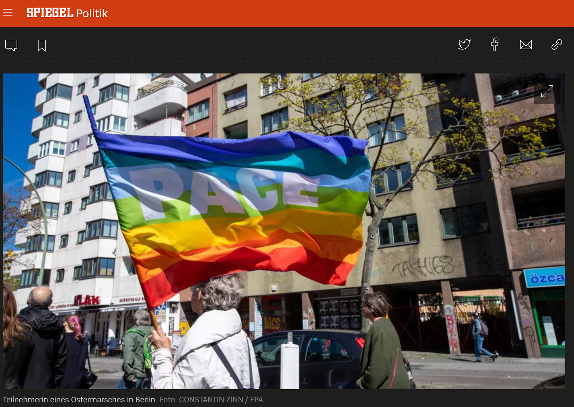 A participant in the Ostermarsch ('Easter March') carries a peace flag in Berlin, Germany, 16 April 2022. This year’s peace and Easter marches are taking place in the backdrop of the ongoing Russian invasion of Ukraine. EPA-EFE/CONSTANTIN ZINN