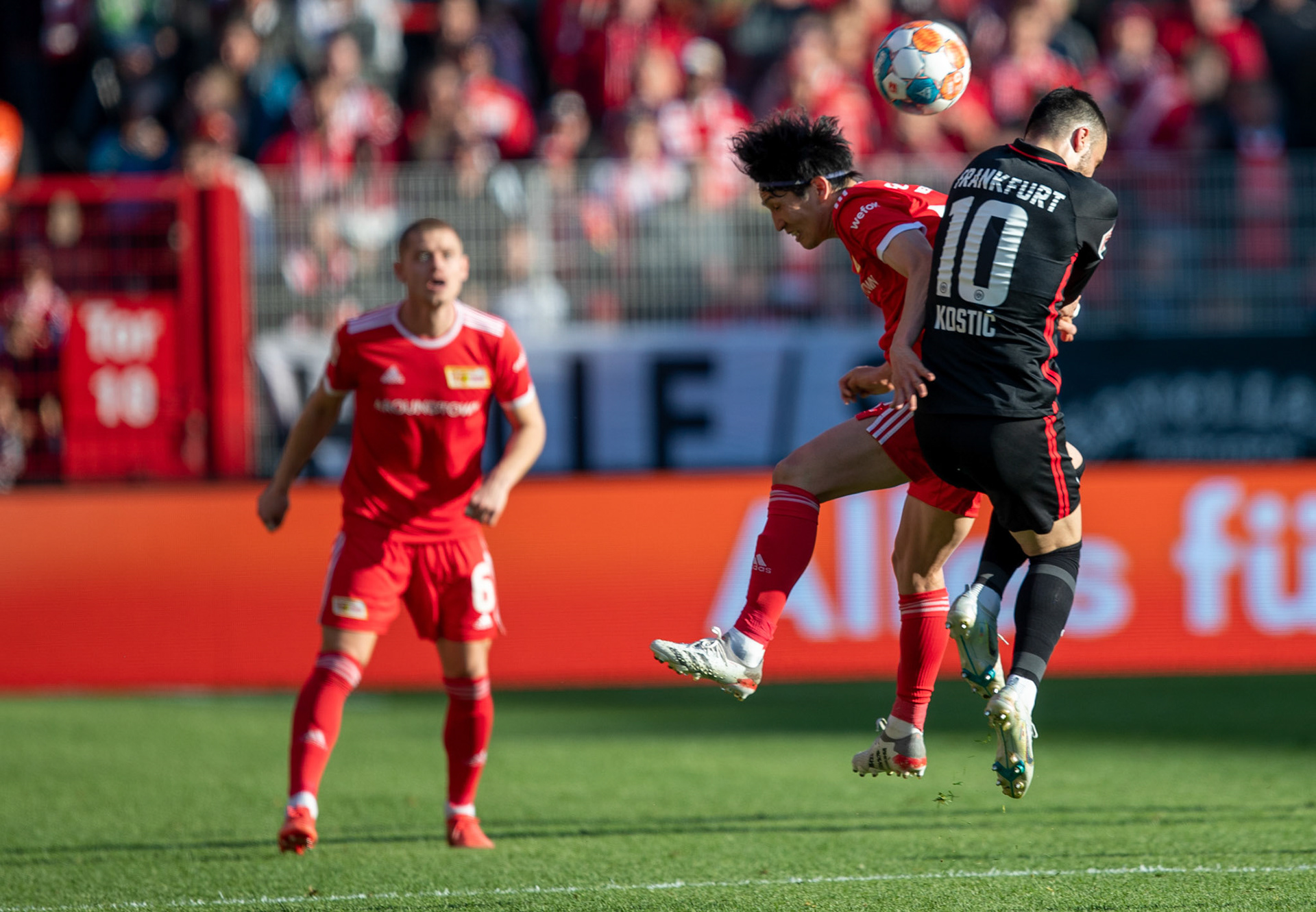 Union’s  Genki Haraguchi (L) and Eintracht’s Filip Kostic in action during the German Bundesliga soccer match between Union Berlin and Eintracht Frankfurt in Berlin, Germany, 17 April 2022.