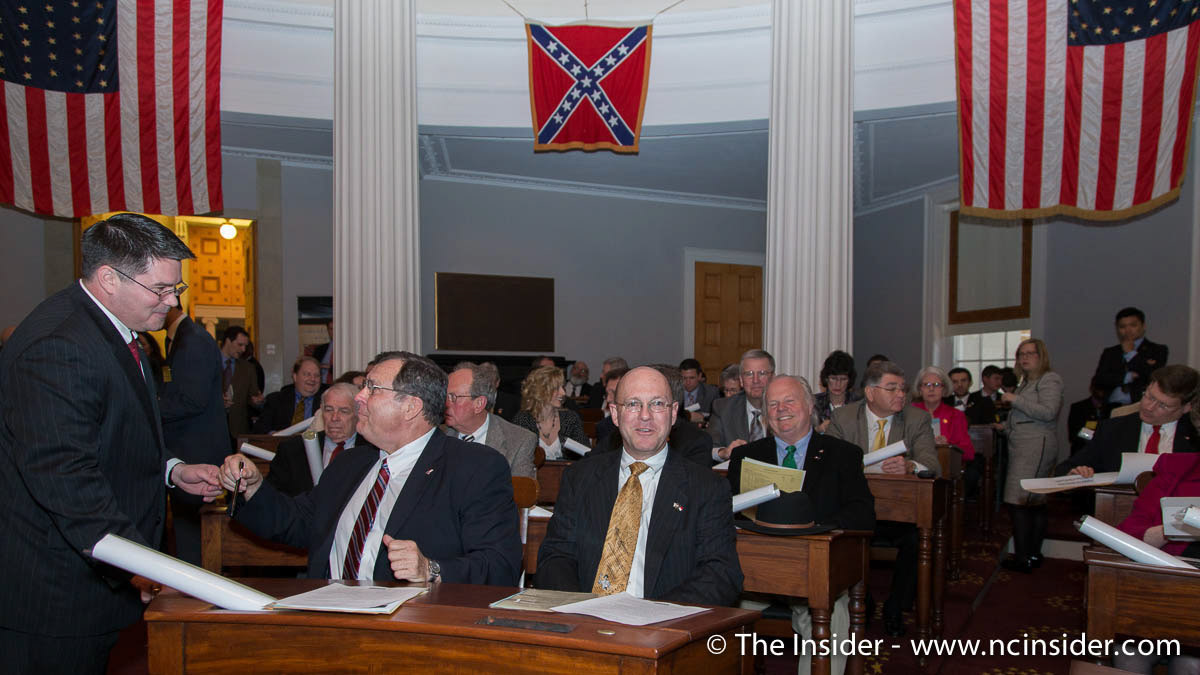 Historic flags, including a Confederate Battle Flag, on display in the House Chamber of the North Carolina State Capitol during a session of the N.C. House on March 18, 2013. The legislature met in the 1840 building to commemorate the state's recovery of its copy of the Bill of Rights, which was removed by Union soldiers in 1865 at the close of the Civil War.