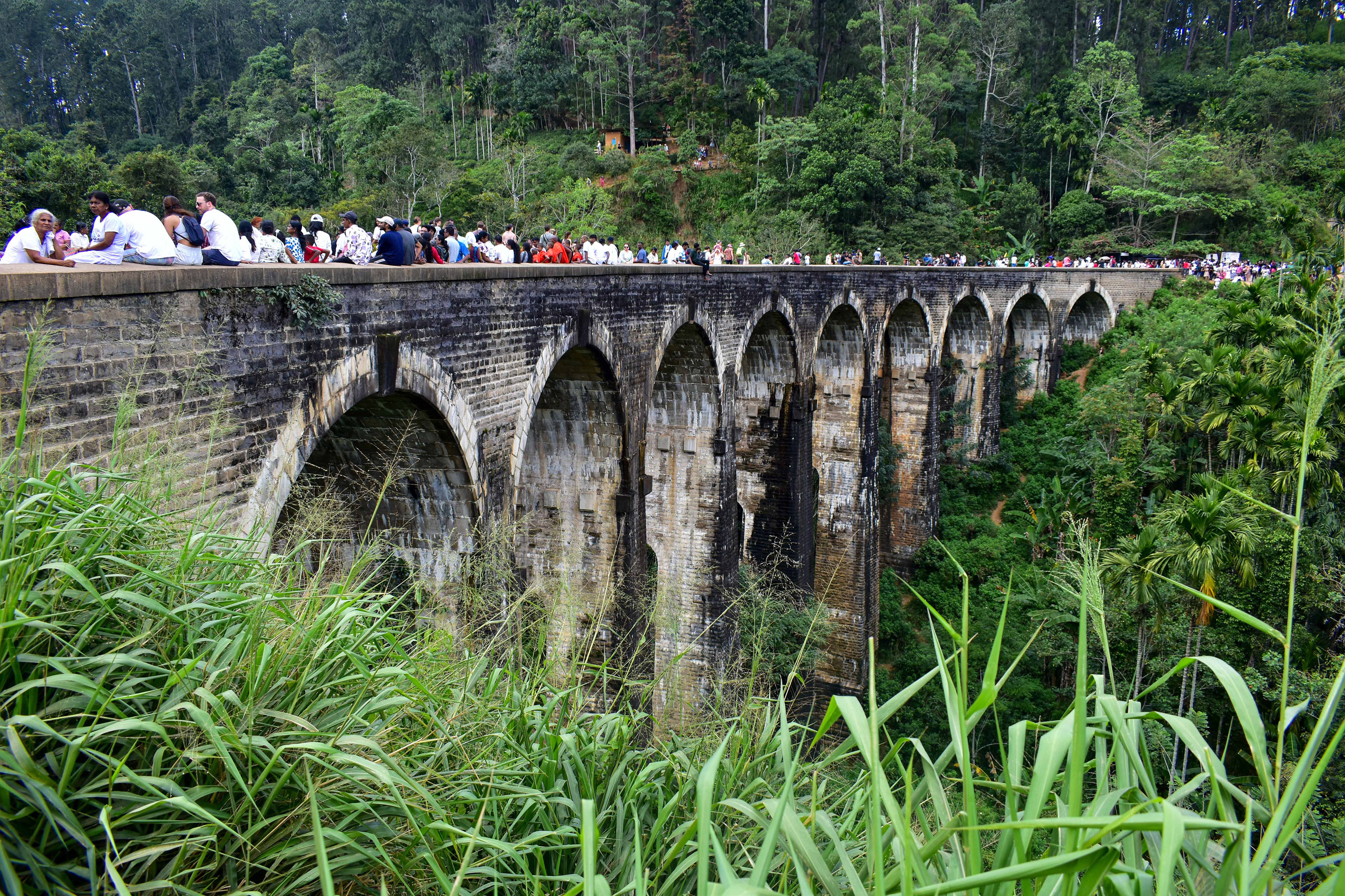 Crowds gather to see two trains go over Nine Arches Bridge