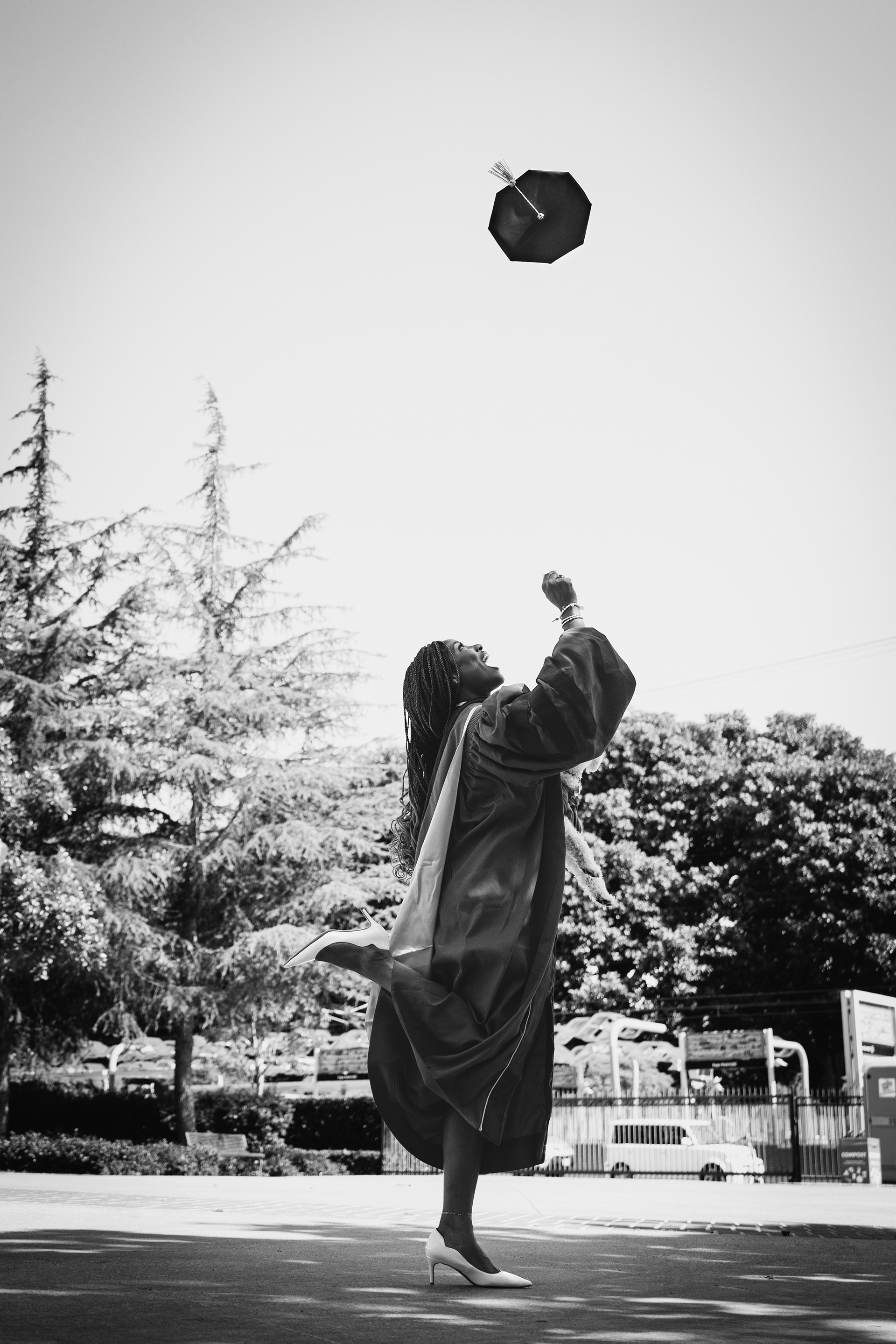 “Graduate celebrating with cap and gown during a portrait session in Los Angeles, photographed by a local graduation photographer.