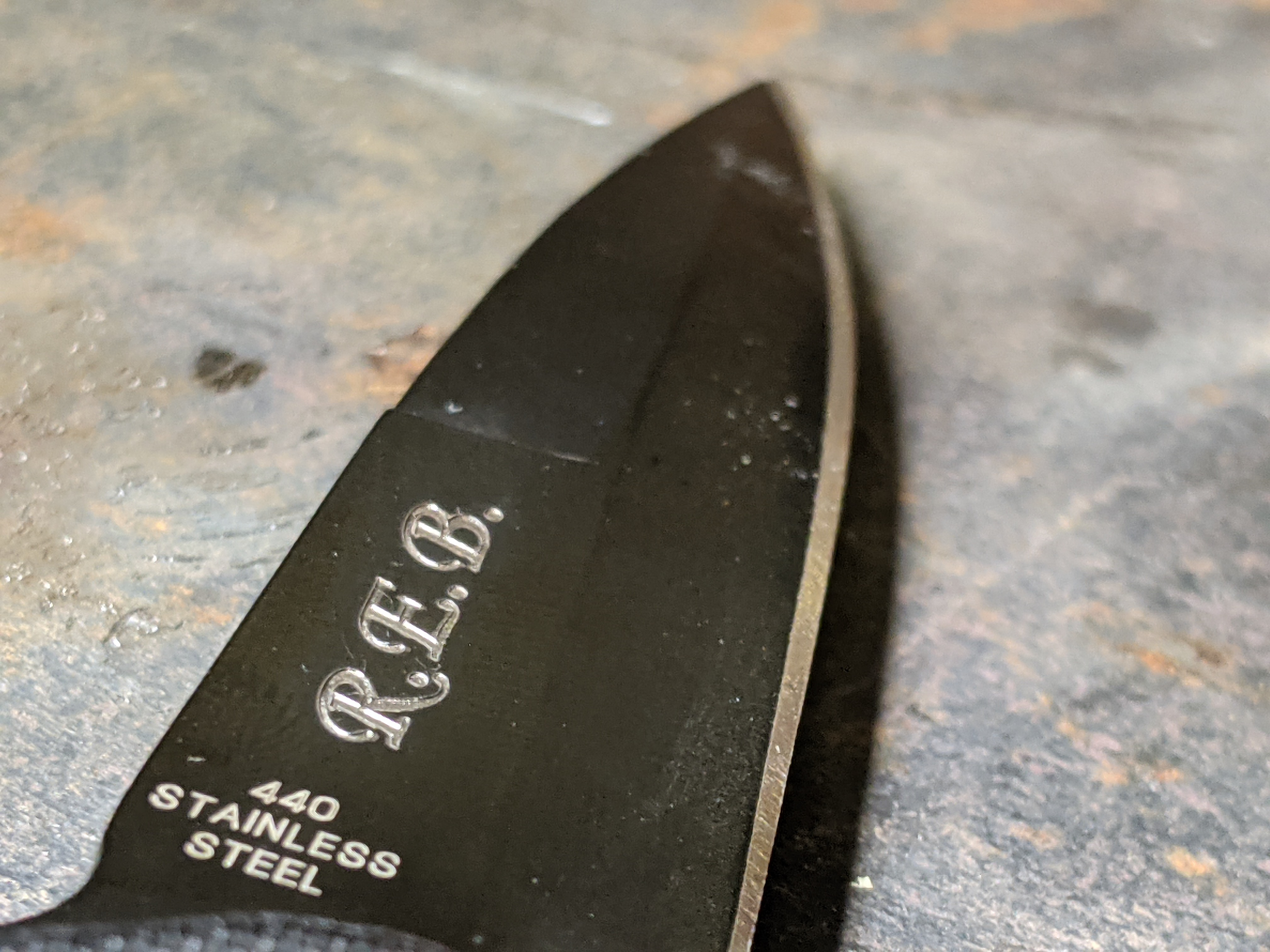 Initials engraved for a customer (blade view)