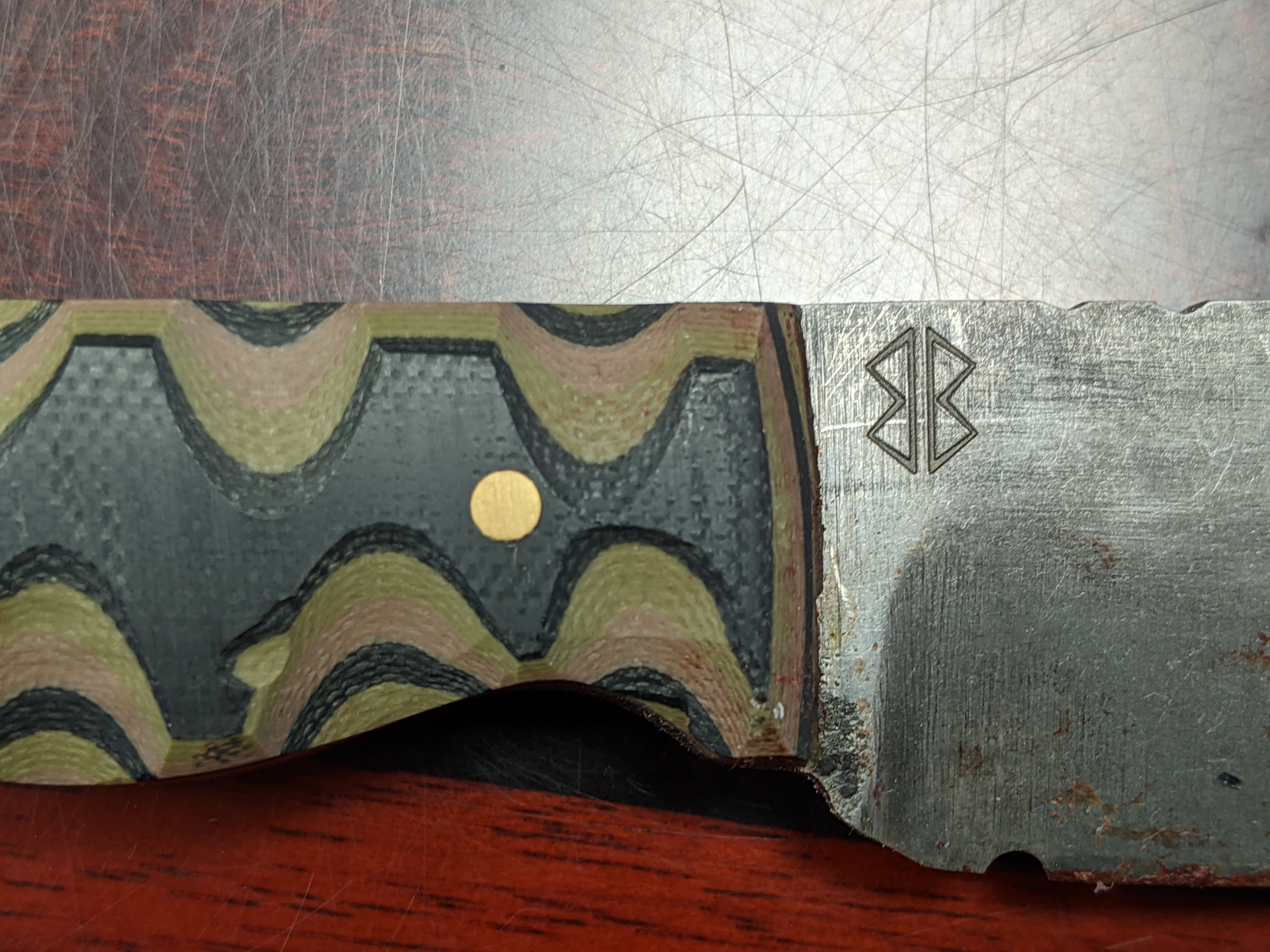 Logo engraving on the Ranger EDC knife for Brackin Blades Forge