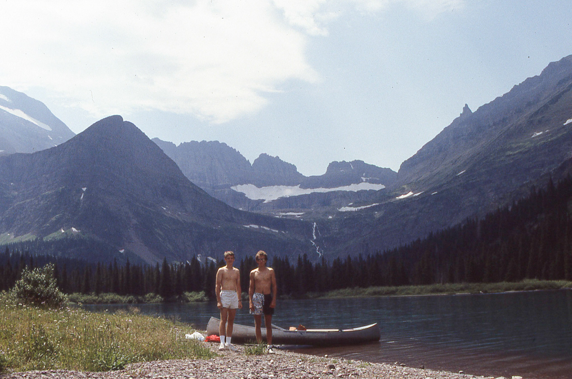 Nate and Barry take a break while canoeing along Swiftcurrent Lake