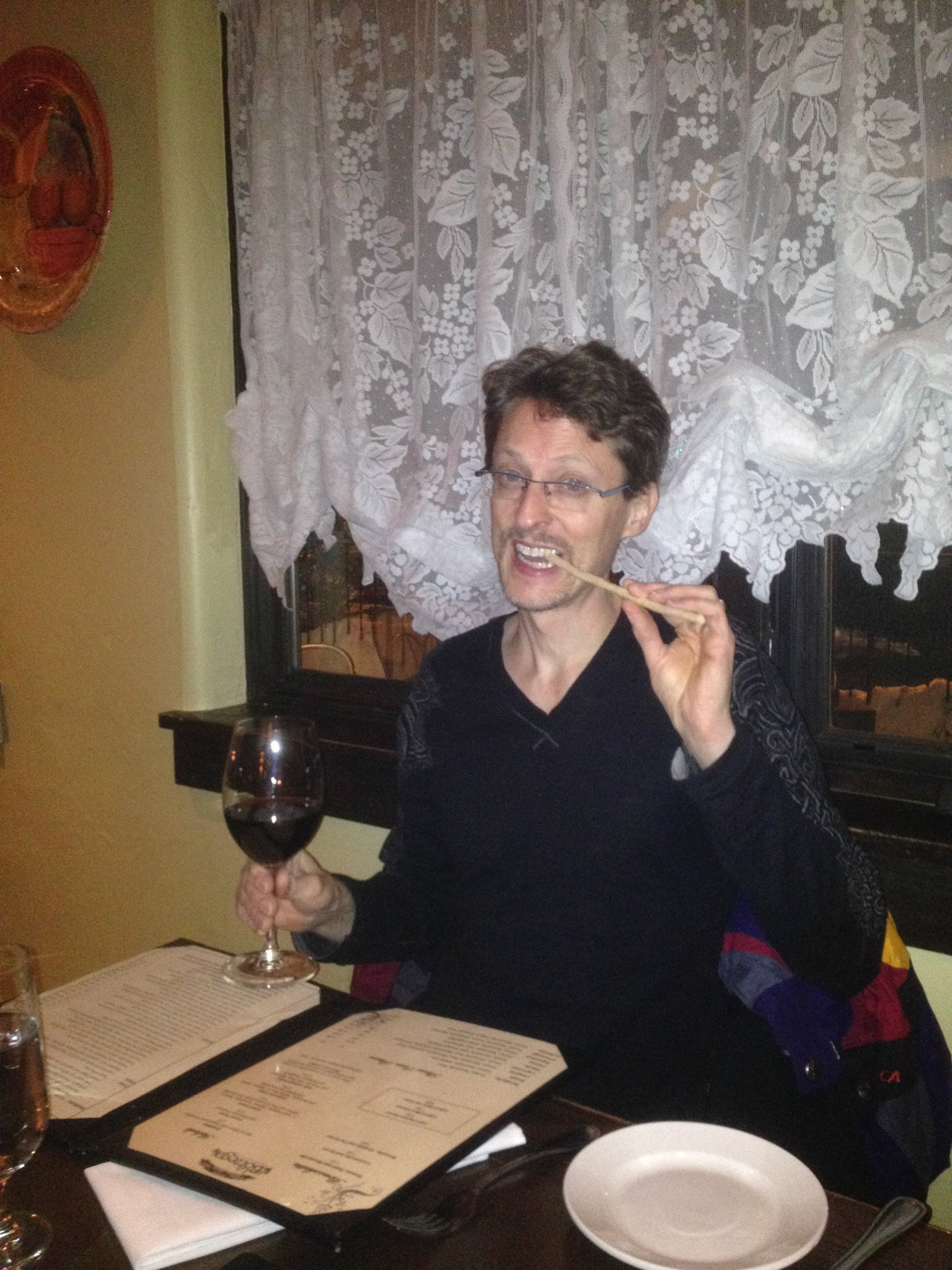 Barry chomps a breadstick at La Bottega