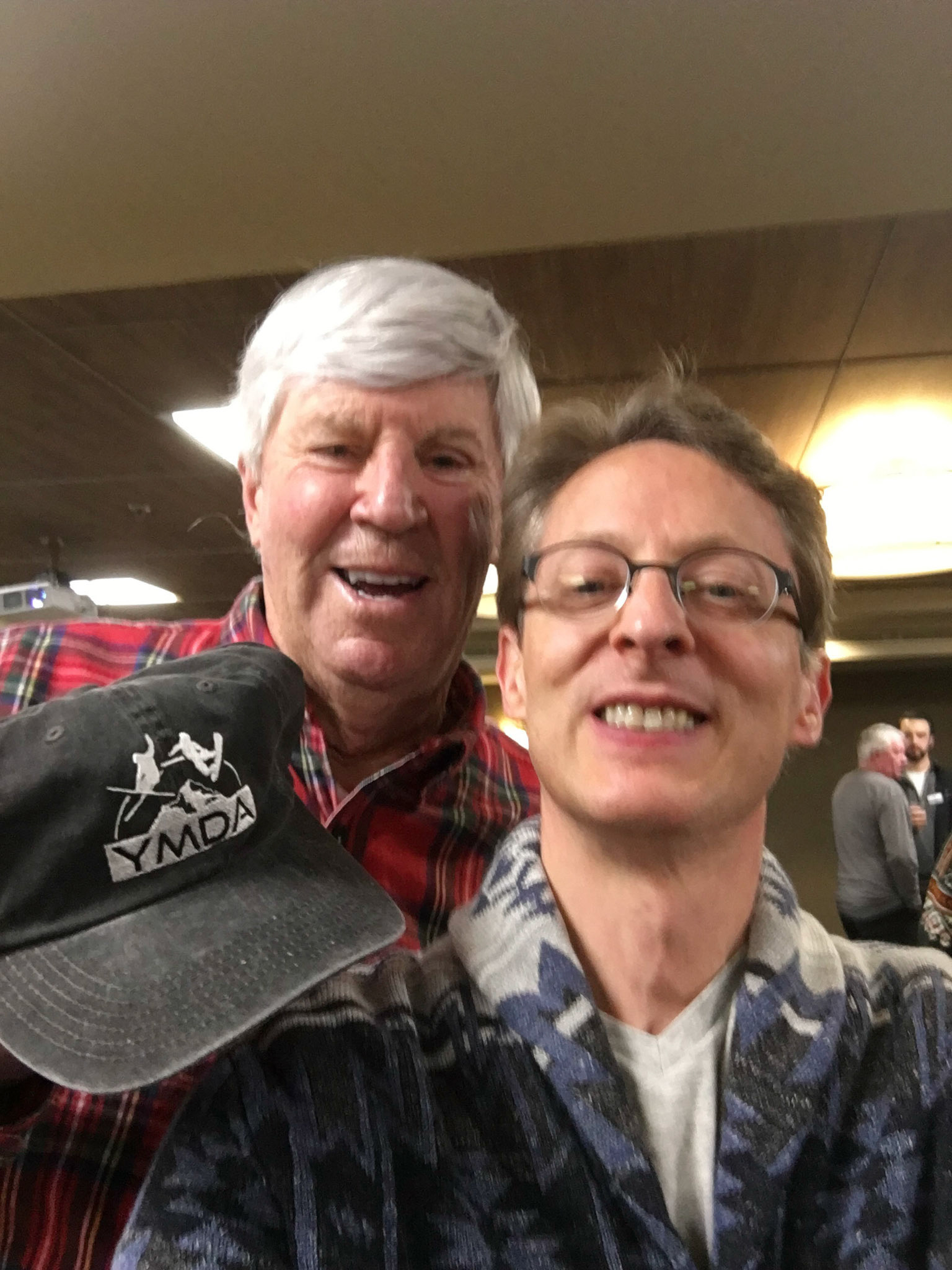 Tom Gray presents Barry with a YMDA 50th anniversary hat