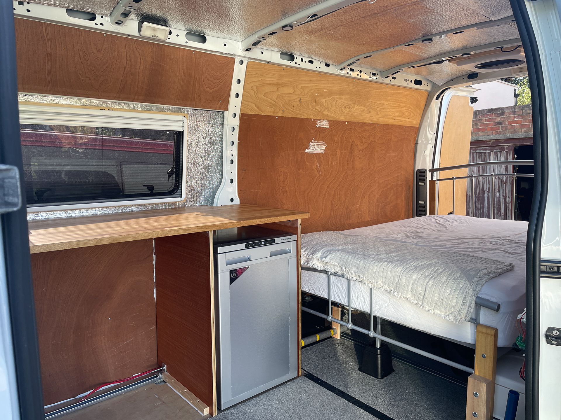 Embryonic Kitchen unit, Fridge, and a bed from IKEA gives us the basic needs for its first weekend away to prove the basics!