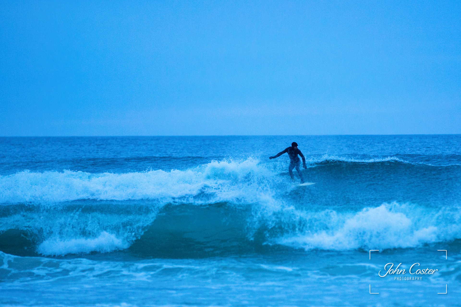 Surfer playing on the evening waves, Cliff Beach, Ilse of Lewis