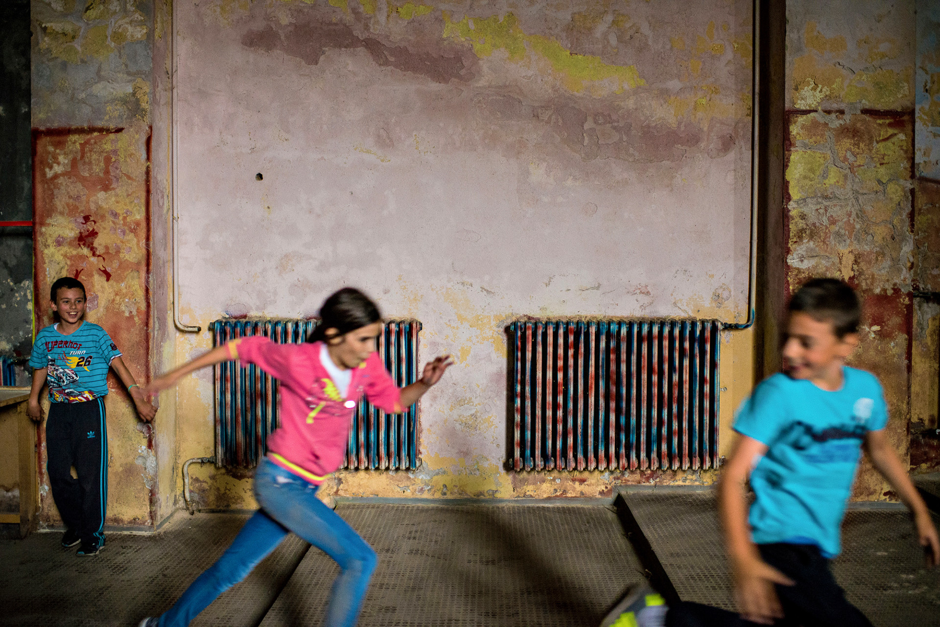 Children play in the cultural Centre of Martinci. Serbia.Martinci 22.05.2015. Cultural centres were very popular in former Yugoslavia especially in the period after the Second World War. Many of them were built long before the war. Today in Serbia, some of them are still in use but very rarely, sometimes even not more than few times a year, and others are completely unusable and became ruins. Nobody invest in them sometimes for more than 20 years. This situation reflects everything that happened to the country from 1990