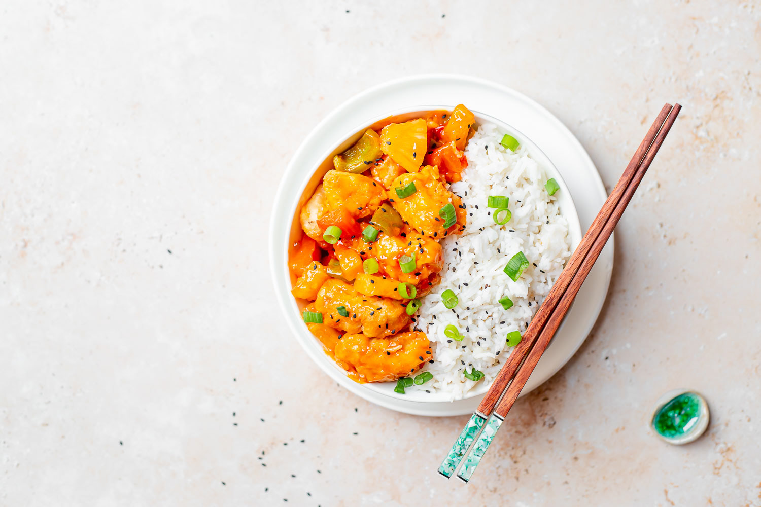Sweet and sour chicken in a bowl with rice