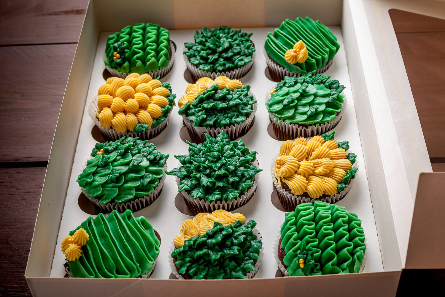 Selection of jungle-themed handmade chocolate cupcakes