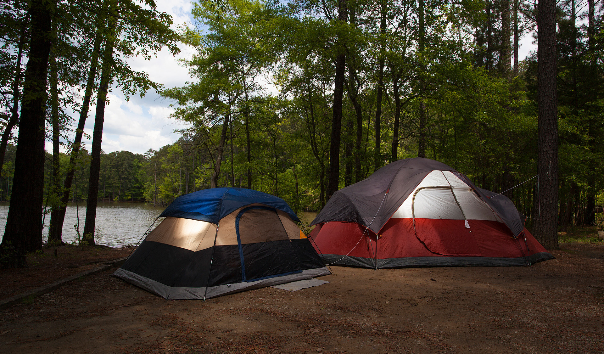 Two lighted tents at Jordan Lake by Guy Sagi