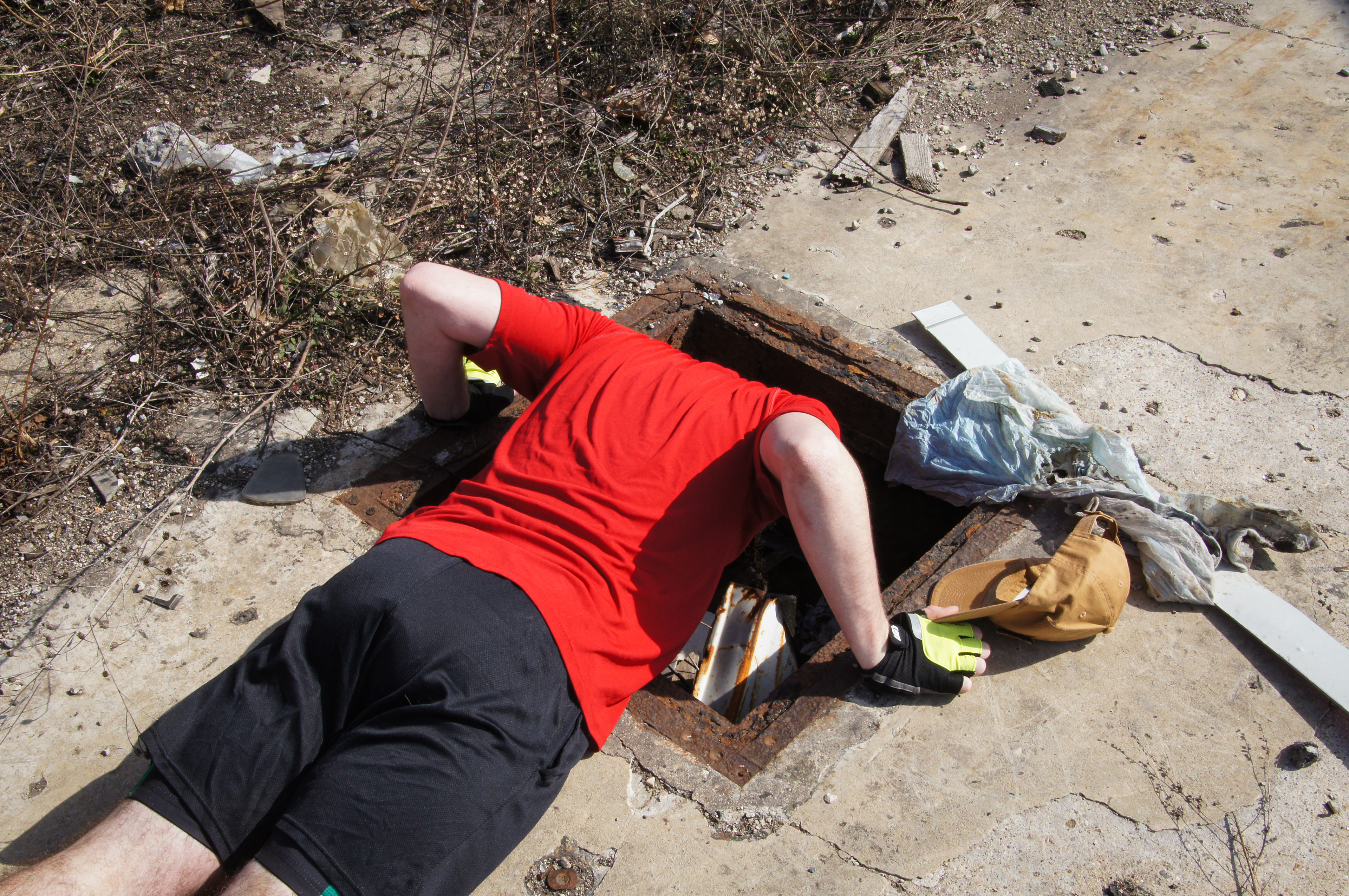 My friend Bryce inspects an entrance to a tunnel that runs underneath the field. 