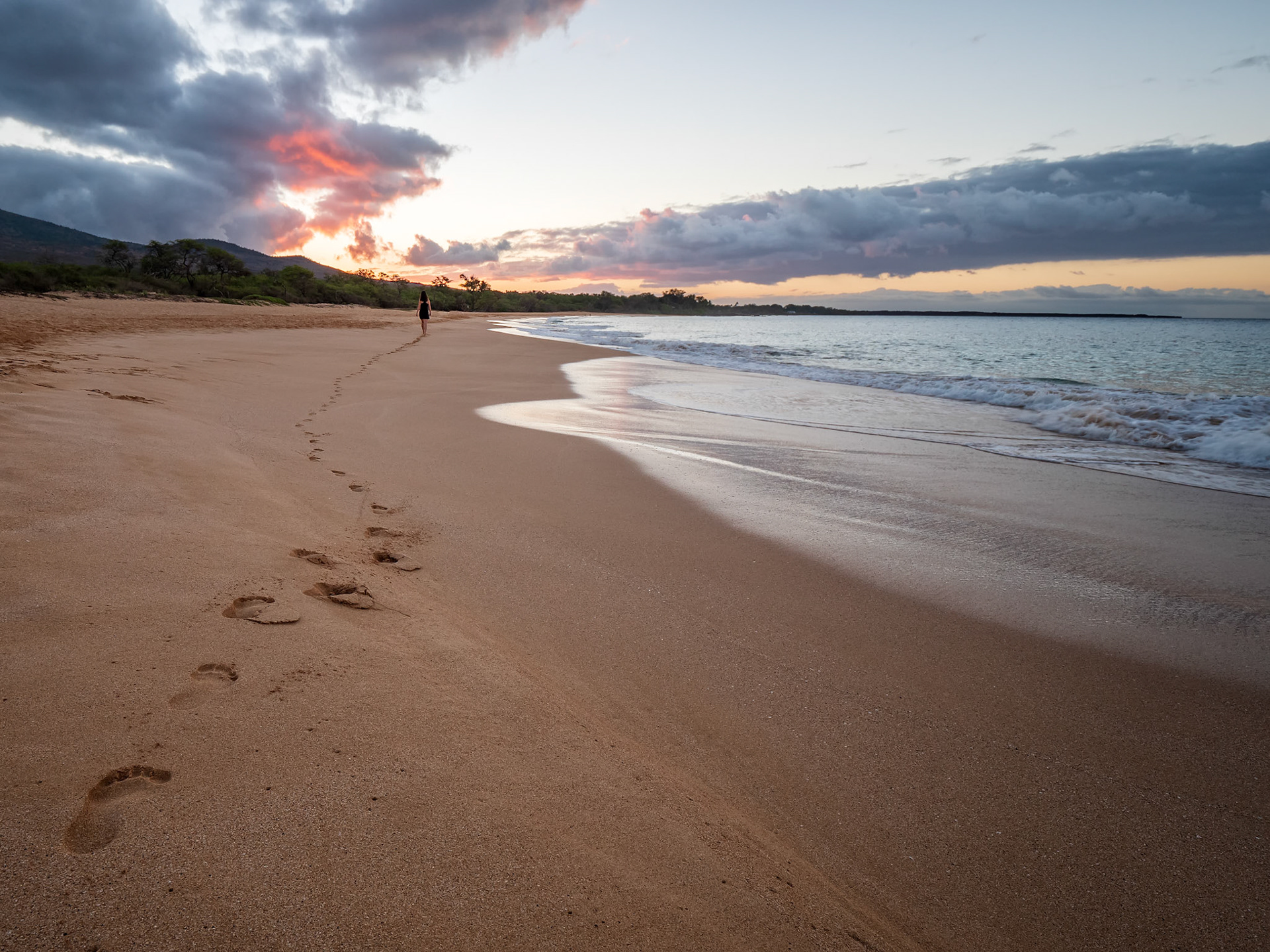 My wife taking a stroll down big beach, just outside of Kihei, Hawaii.