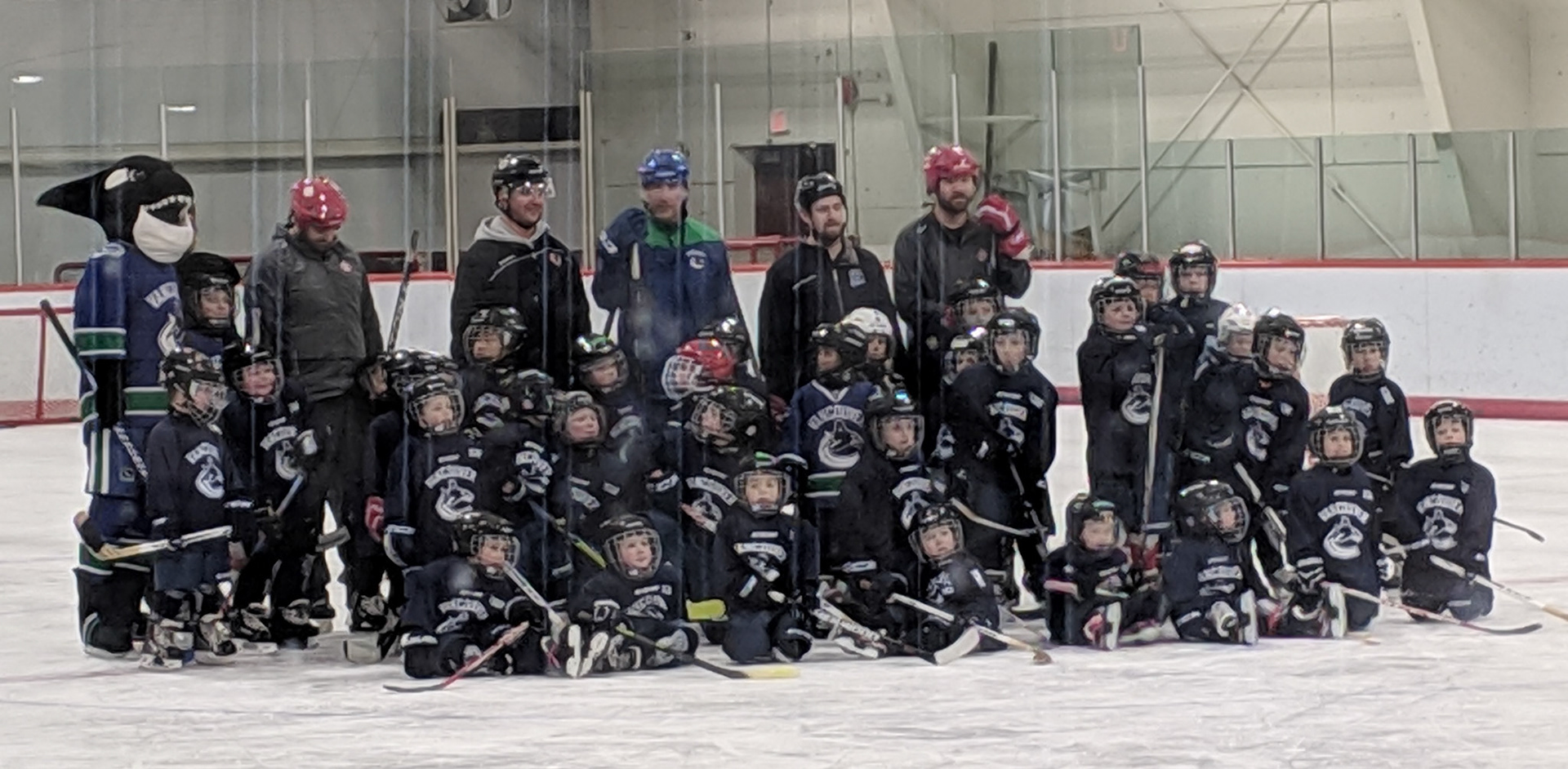 Jackson's canucks hockey team.  He is standing on the far right.