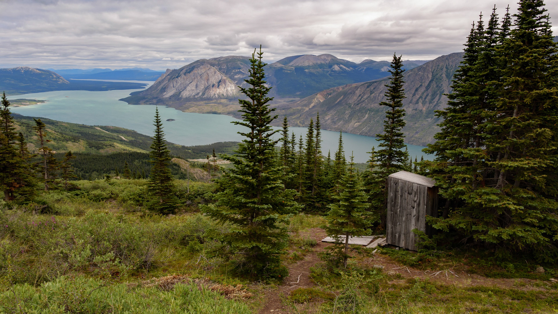 Old outhouse at the top of the Sam McGee trail in Carcross, Yukon, Canada