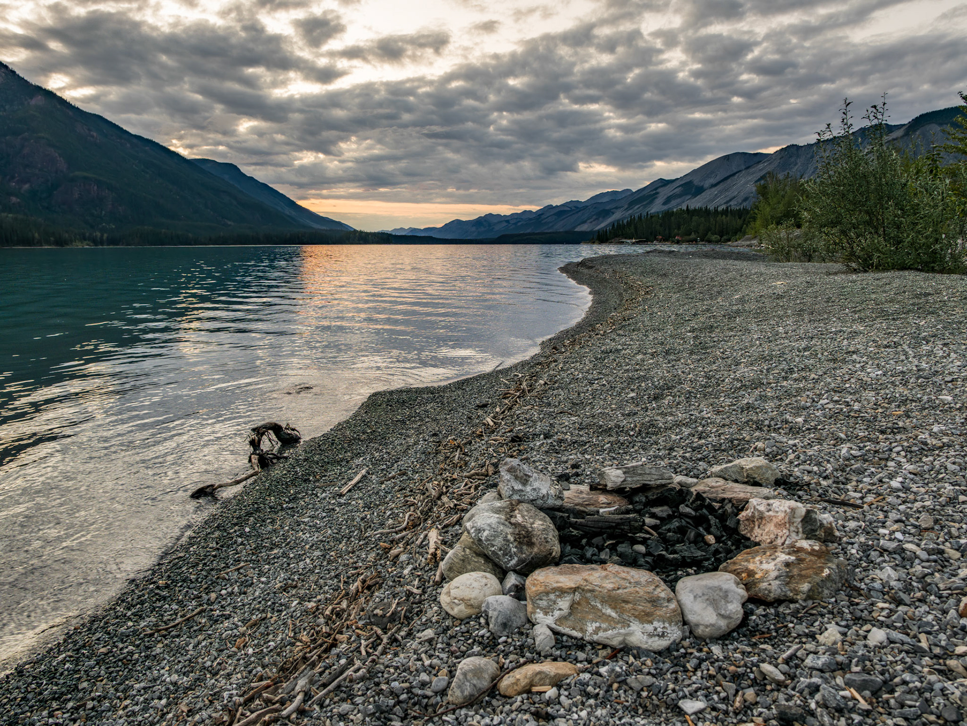 Small firepit along the shores of Muncho Lake.