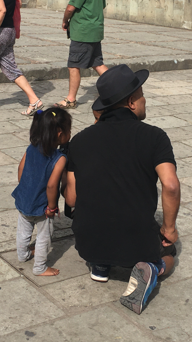 Lili and Juan Escobedo discussing the shot.