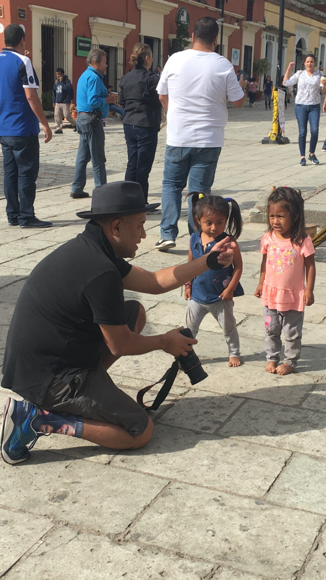Juan Escobedo and Lili's friend asking them to pose for a photo.