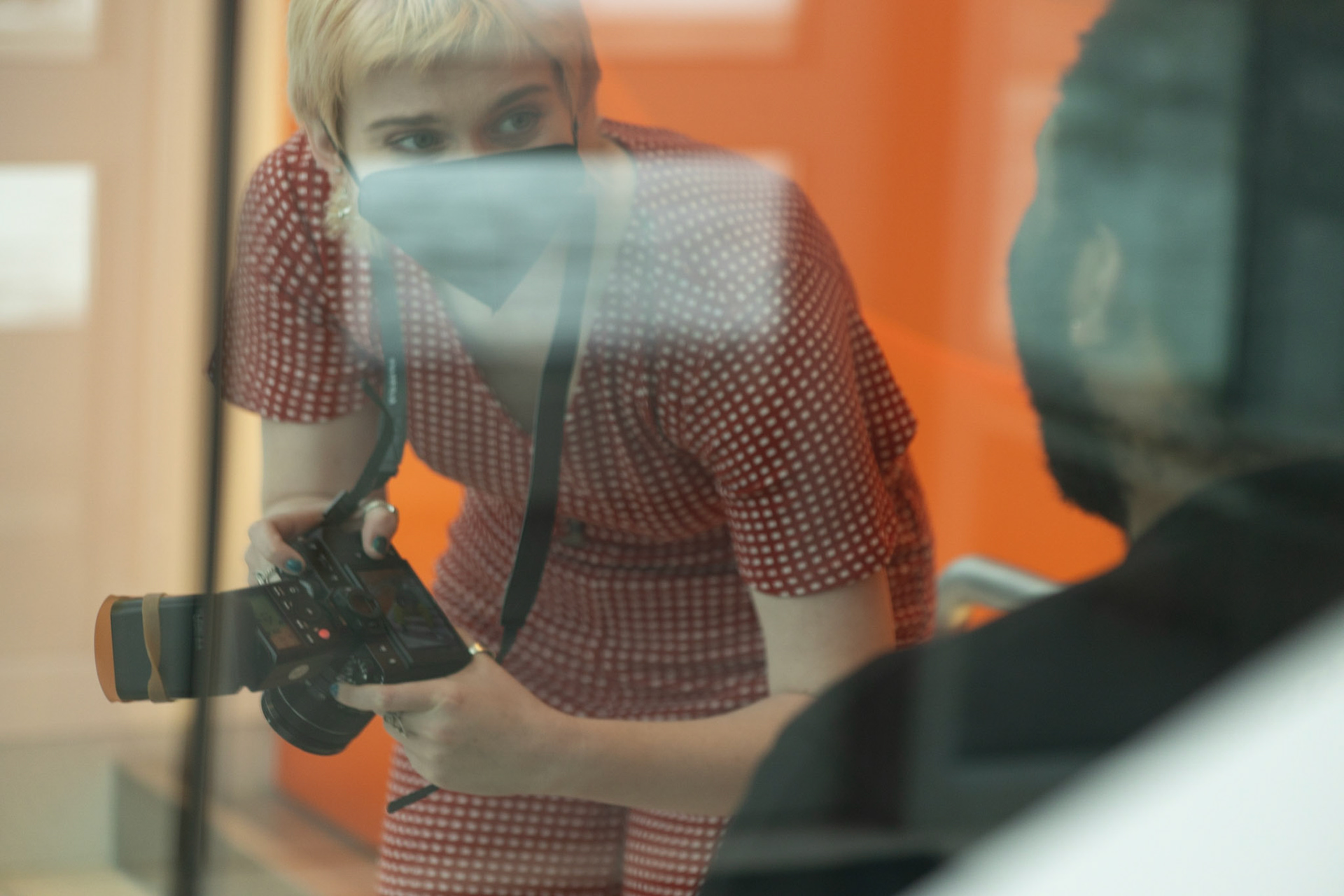 Em Burris captures images of Michael Spencer around Newhouse for their LGBTQ+ Fashion Project. Images taken 02/19/22. Em Burris shows images they took of Michael Spencer to him as the shoot progresses. They are looking to capture the subjects style and mirror it with a picture of atmosphere in a realistic sense of humanity.