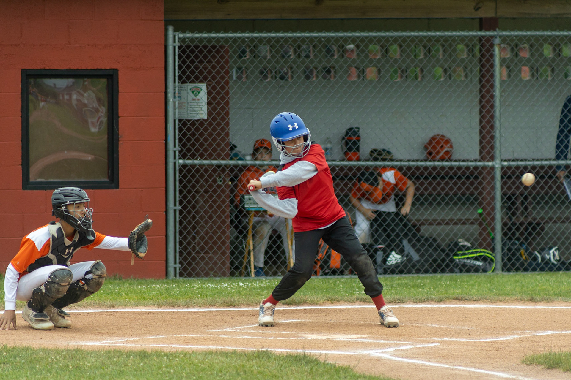 Cole Conzone (#9) swings for the ball during the June 18th game at Lagoe field between the Elks and the Firefighters.