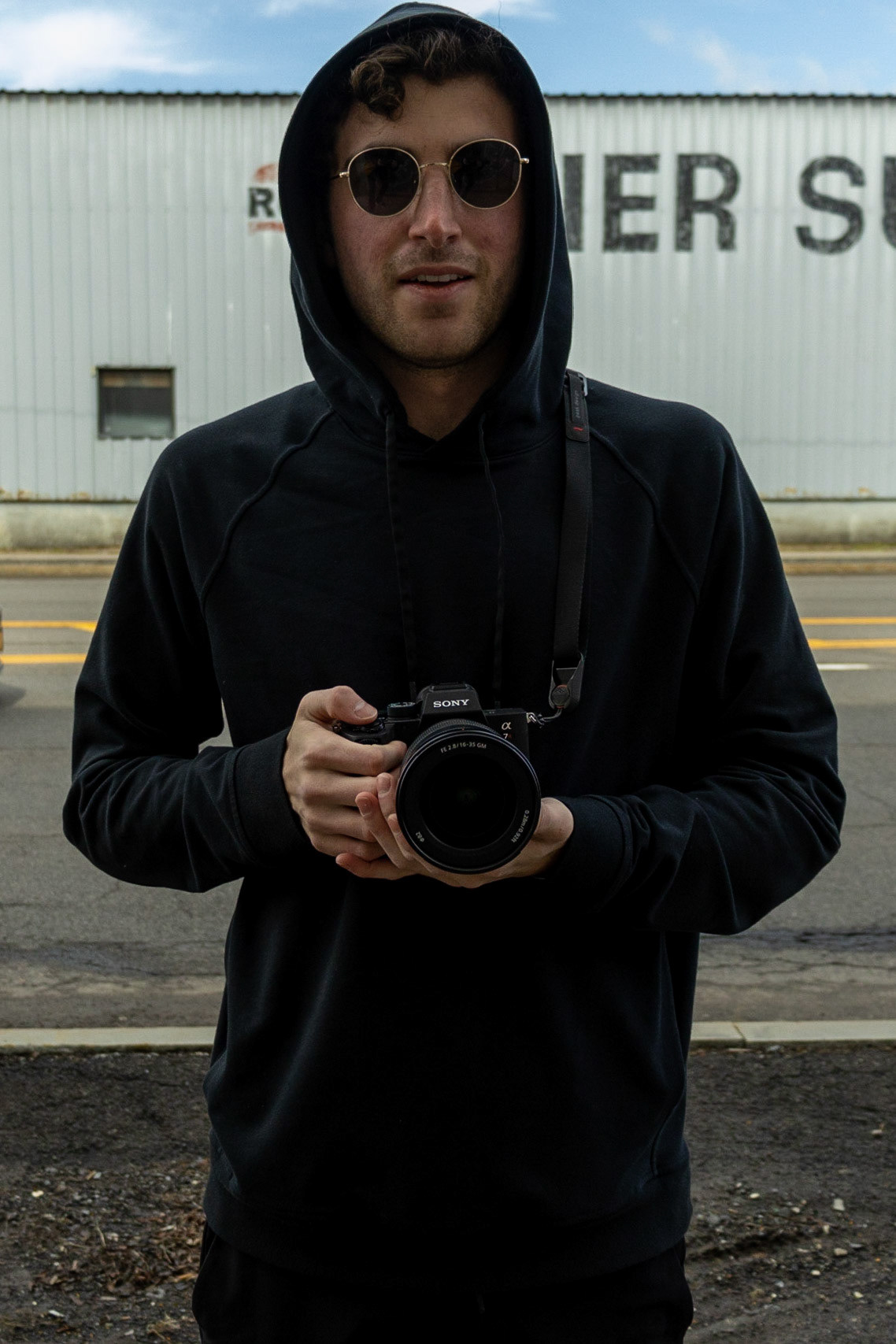Jacob Wilkes, while taking pictures of street art he has worked on, enters and explores the Abandoned Train Station in Syracuse. Taken on 04/04/2022. Jacob typically tries to remain anonymous by wearing simple clothing that hides his defining features in an attempt to avoid recognition.