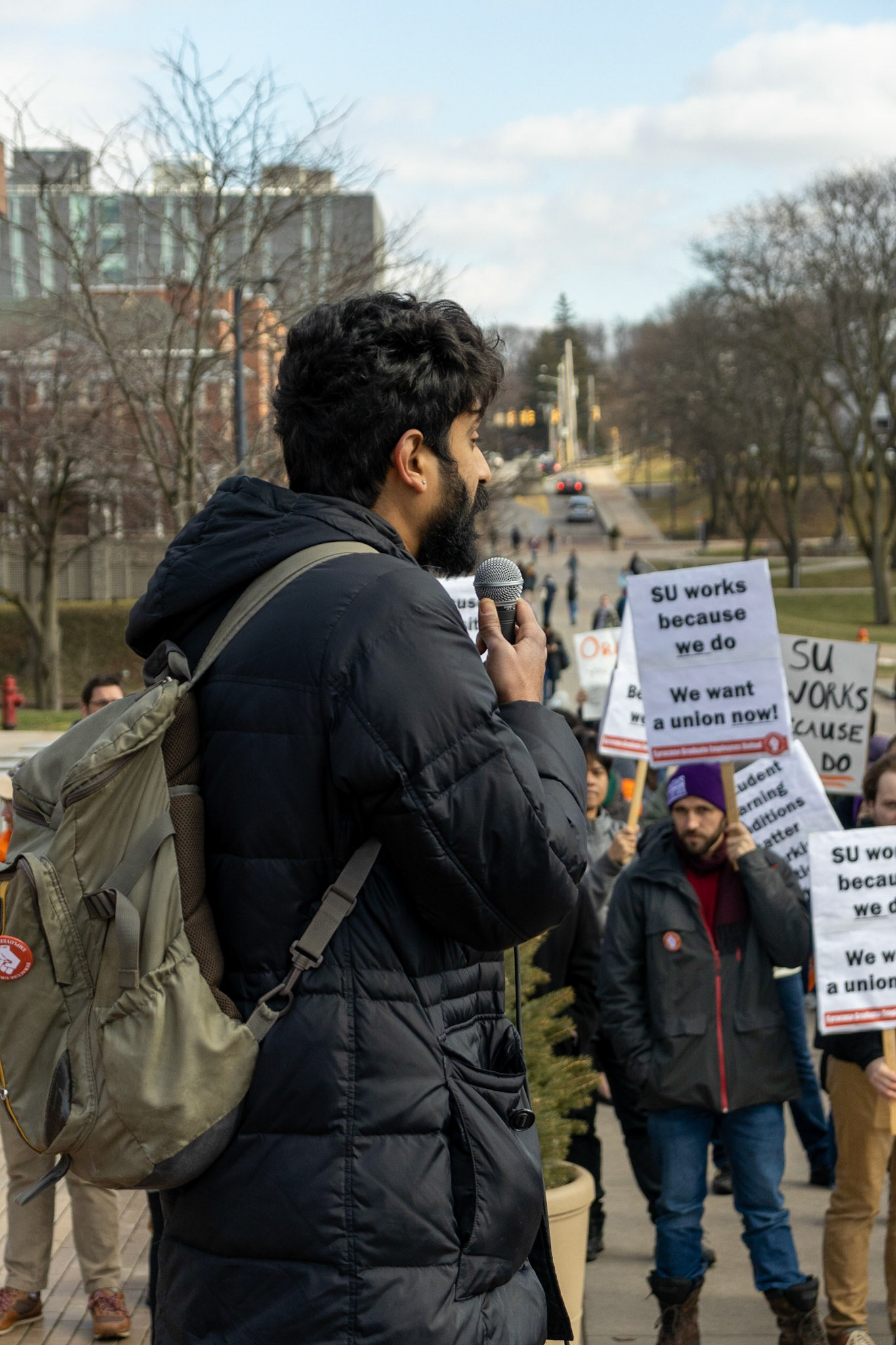 The Syracuse Graduate Employees Union gathered fellow students, supporting faculty and staff, as well as regular observers at the steps of Carnegie Library as they advocated for the University to recognize the union and accept the union's demands. The group then marched to the student center and onwards to the administration building where leaders would meet with the Provost.