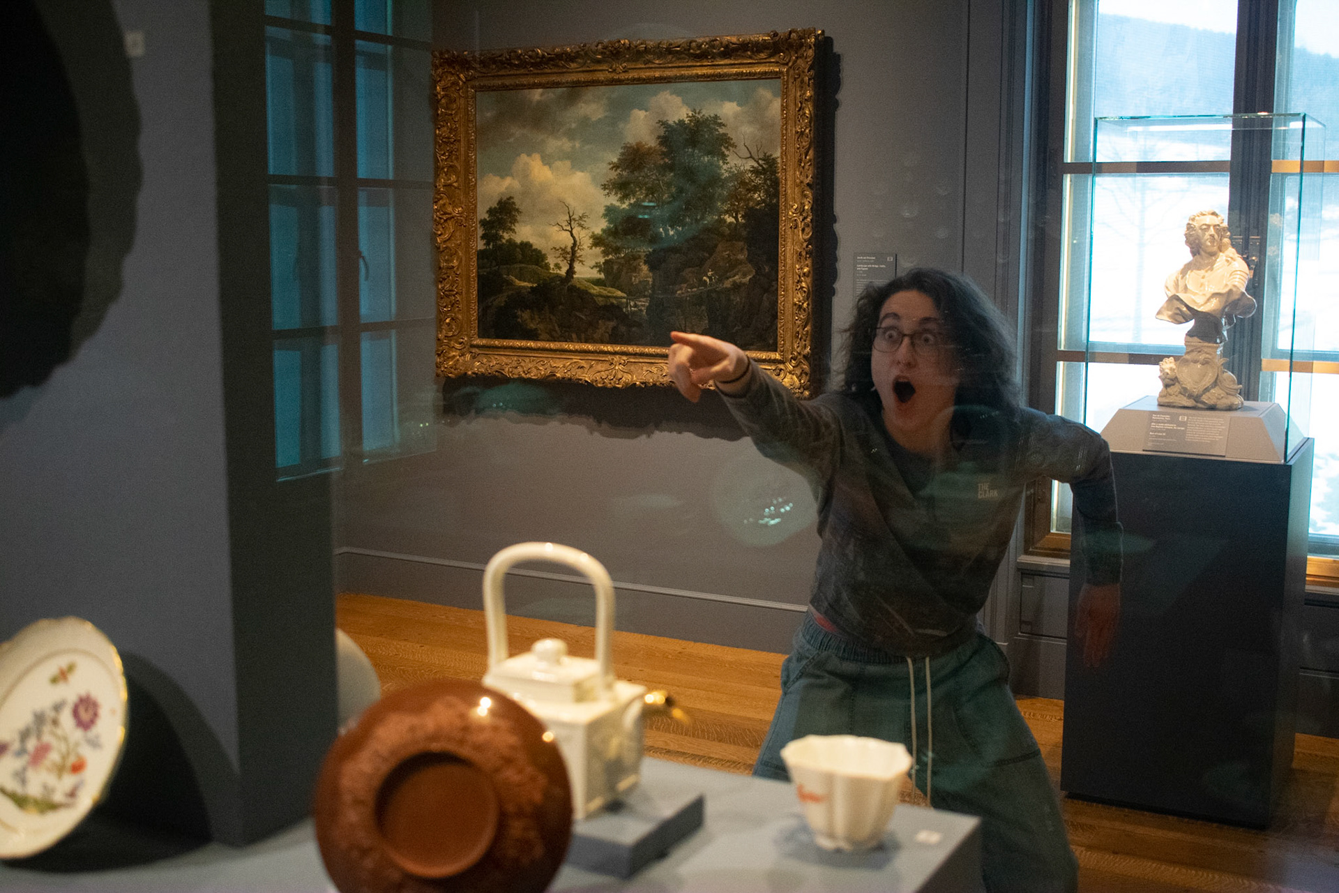 Sophie Throop points mokingly at fine china. I didn't plan this position, however, it became a motif of the photoshoot and I caved int creating just one image. She did so at the Clark Institute on February 22nd.