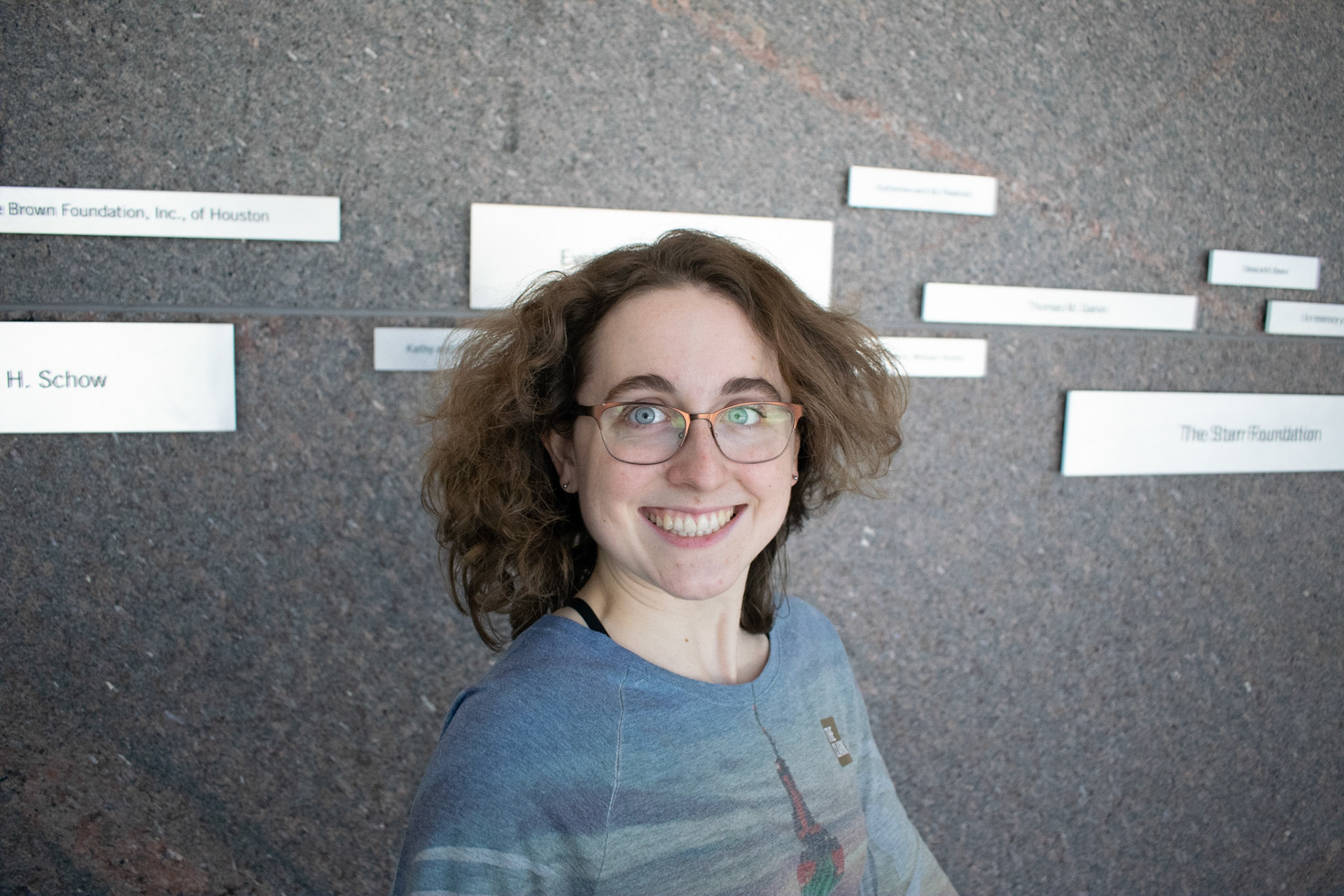 Sophie Throop, an art student at Williams College views art exhibits at The Clark Institute on February 22nd. This image I tried getting a stop action as she turns her head quickly to get her hair to rise. The smile was not planned, but I still enjoy the image immensely.