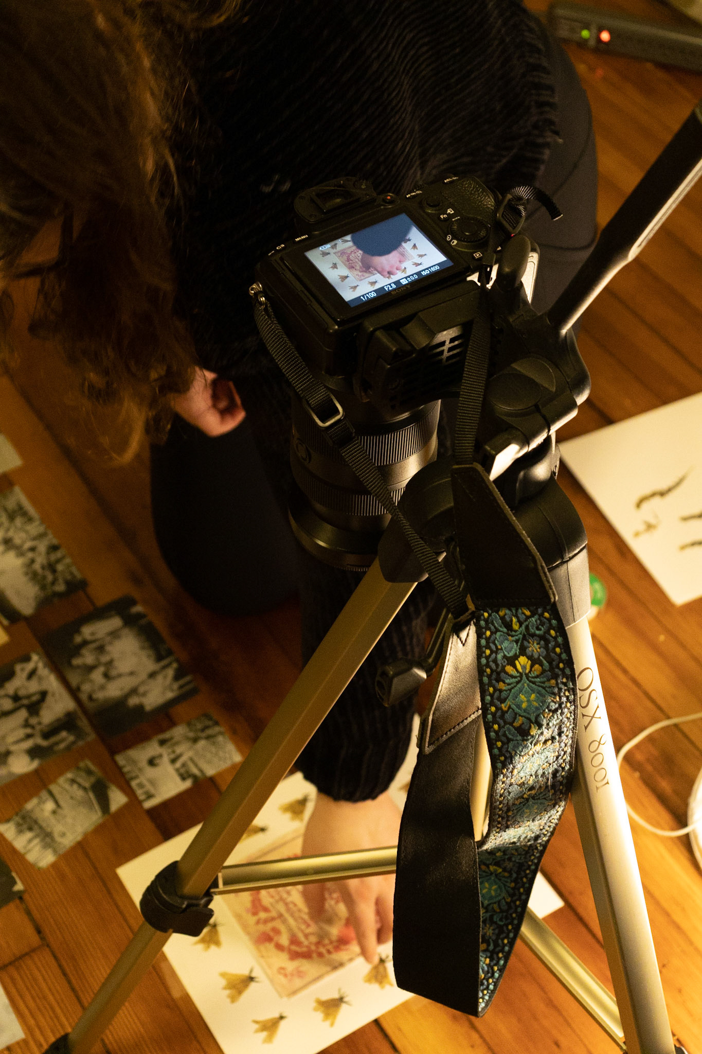 Emily Steinberger captures photos that simulate the layout of a page for her final Honor Thesis Project. The project is focused on conserving Steinberger's family history which was heavily affected by the Holocaust. Taken at Emily's apartment on 04/02/2022. Small, precise movements take precident and she shoots for quality over quantity.