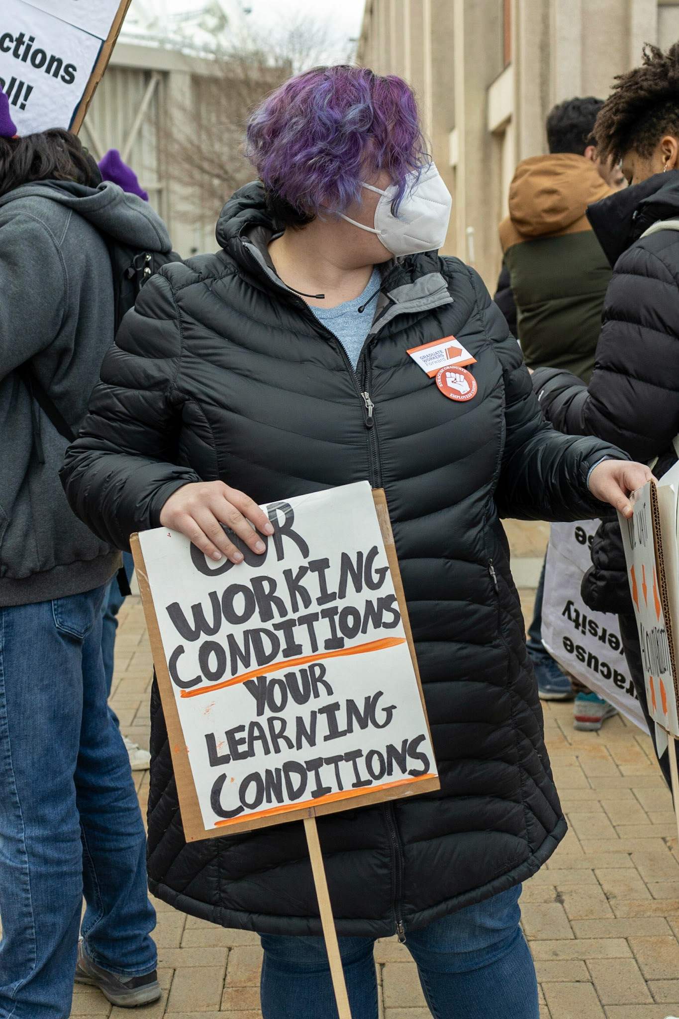 The Syracuse Graduate Employees Union gathered fellow students, supporting faculty and staff, as well as regular observers at the steps of Carnegie Library as they advocated for the University to recognize the union and accept the union's demands. The group then marched to the student center and onwards to the administration building where leaders would meet with the Provost.