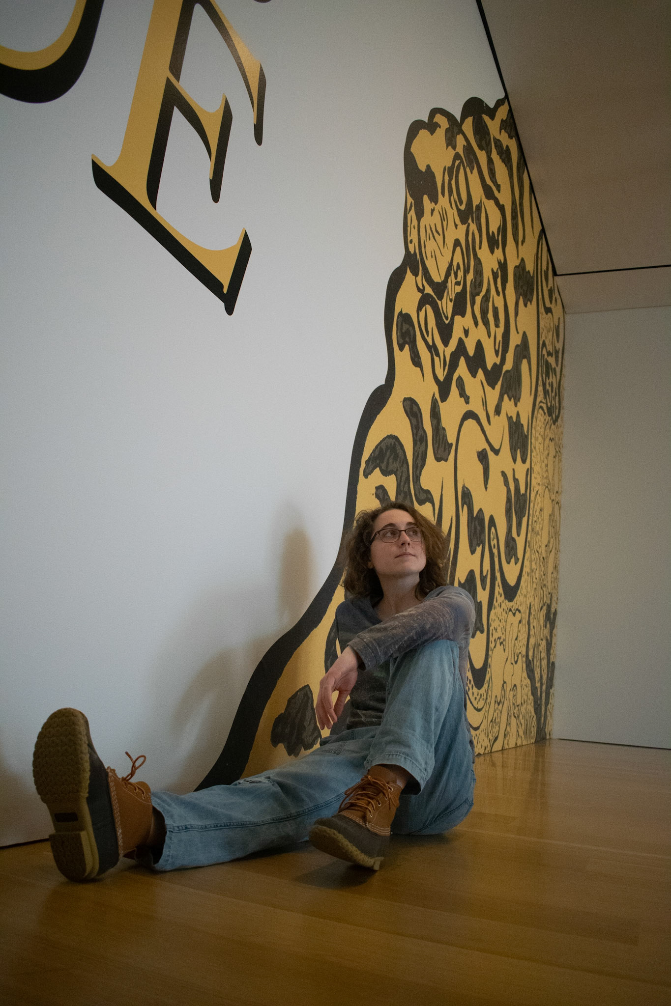 Sophie Throop, an art student at Williams College sits in front of a new art exhibit at The Clark Institute on February 22nd. She looks to the side and up because its cool.