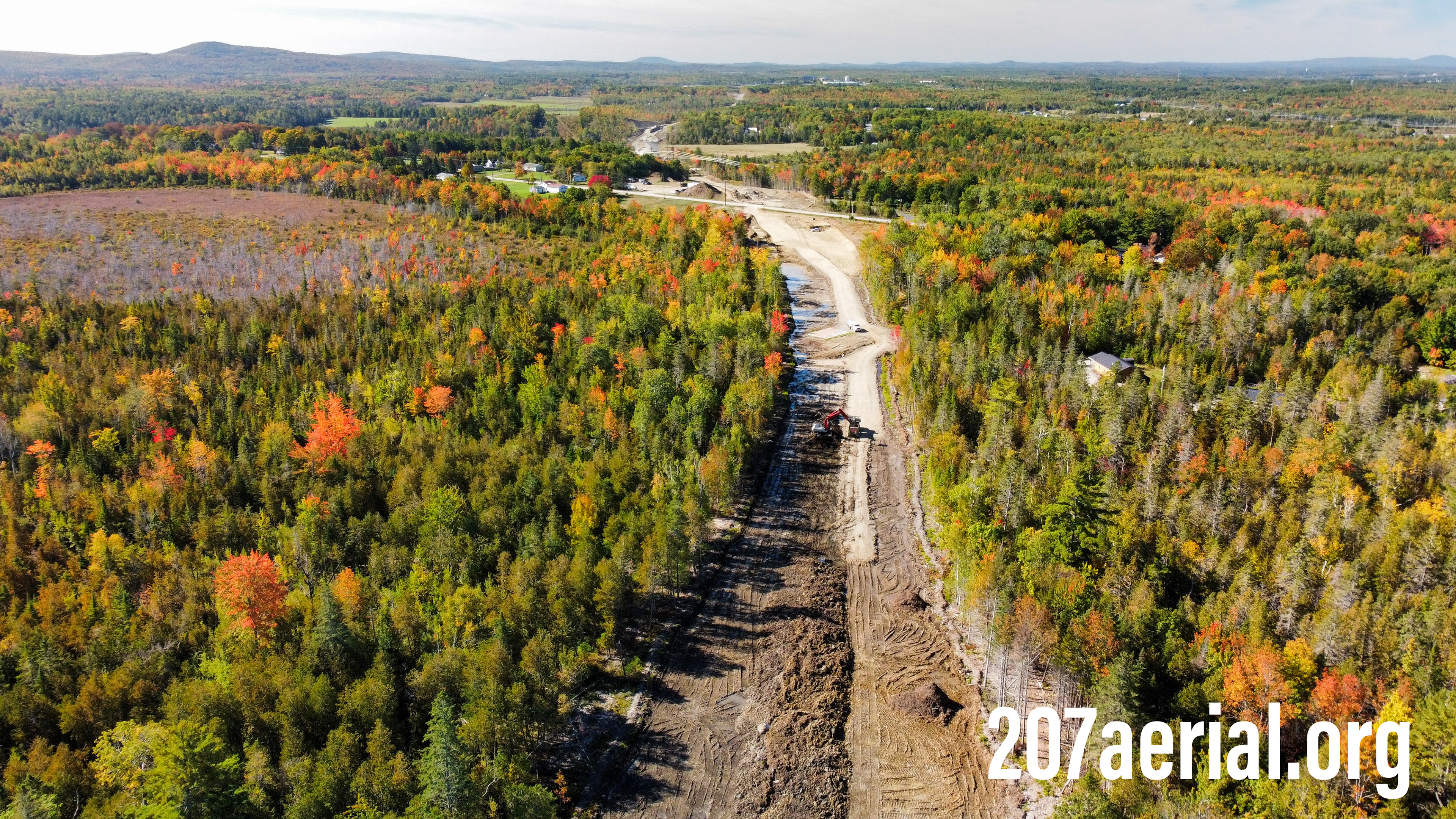 Excavator working on I-395 connector between Levenseller rd and Clewleyville rd near Eddington, ME.