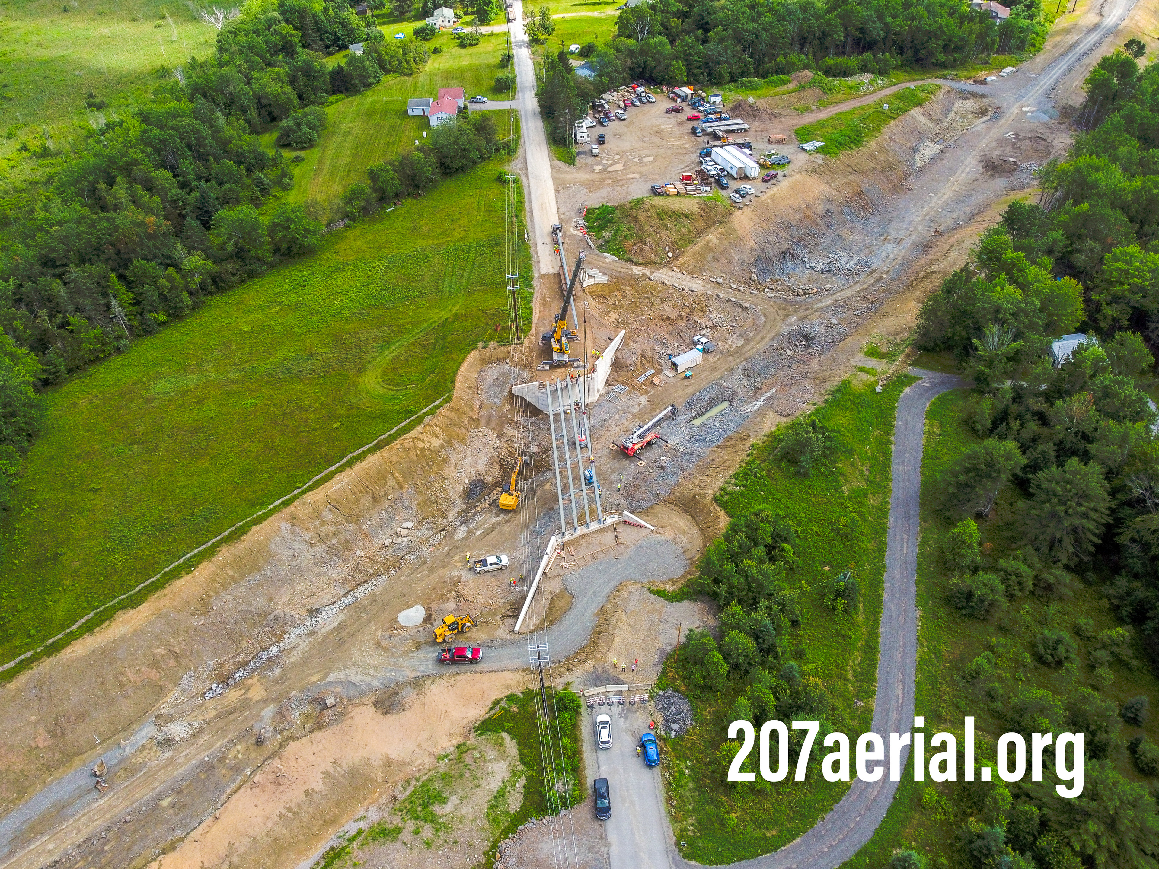 Crane moving parts of the bridge on Clewleyville road in Eddington, Maine. July 2023